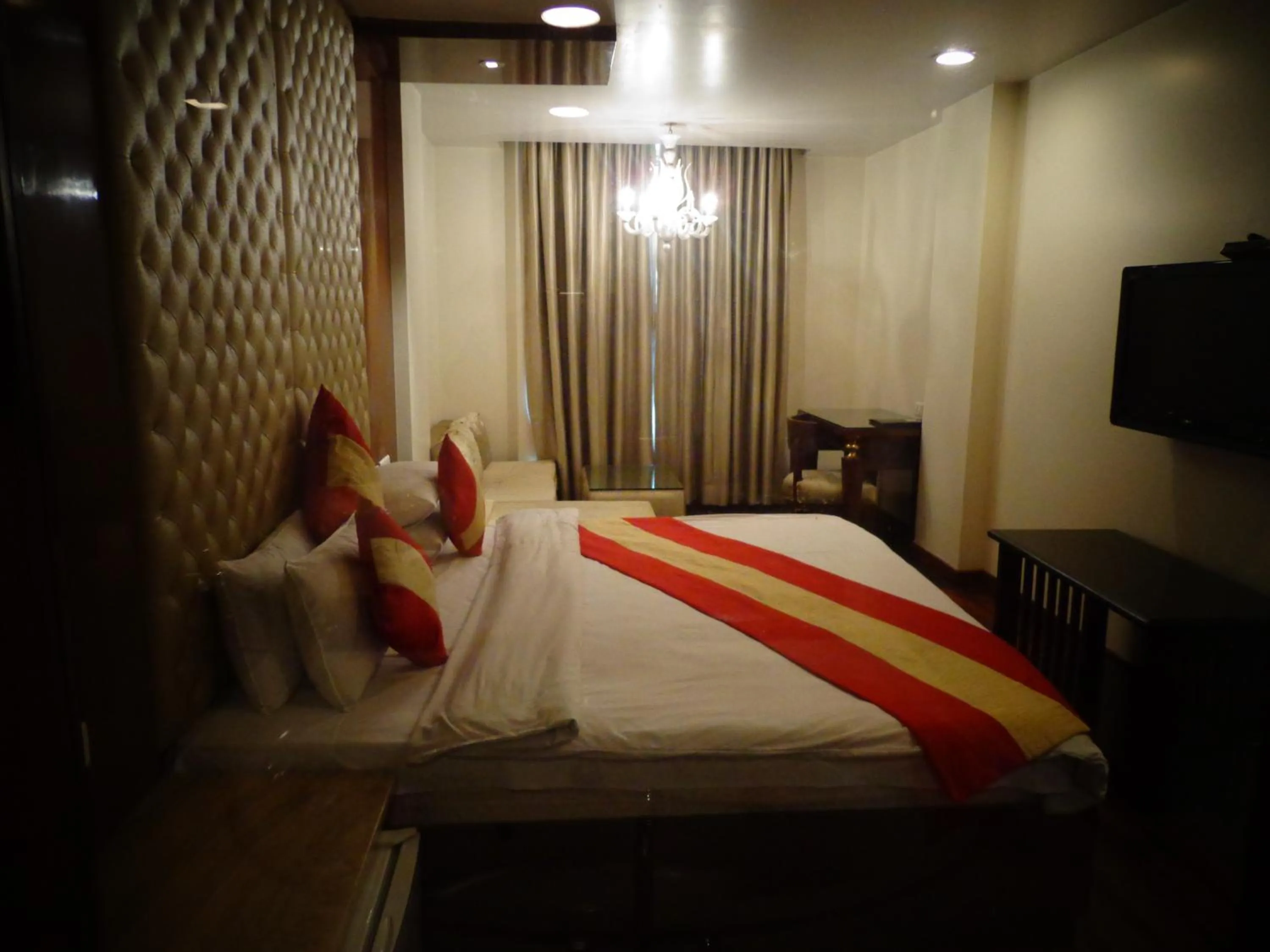 Photo of the whole room, Bed in Hotel Aura Near Connaught Place