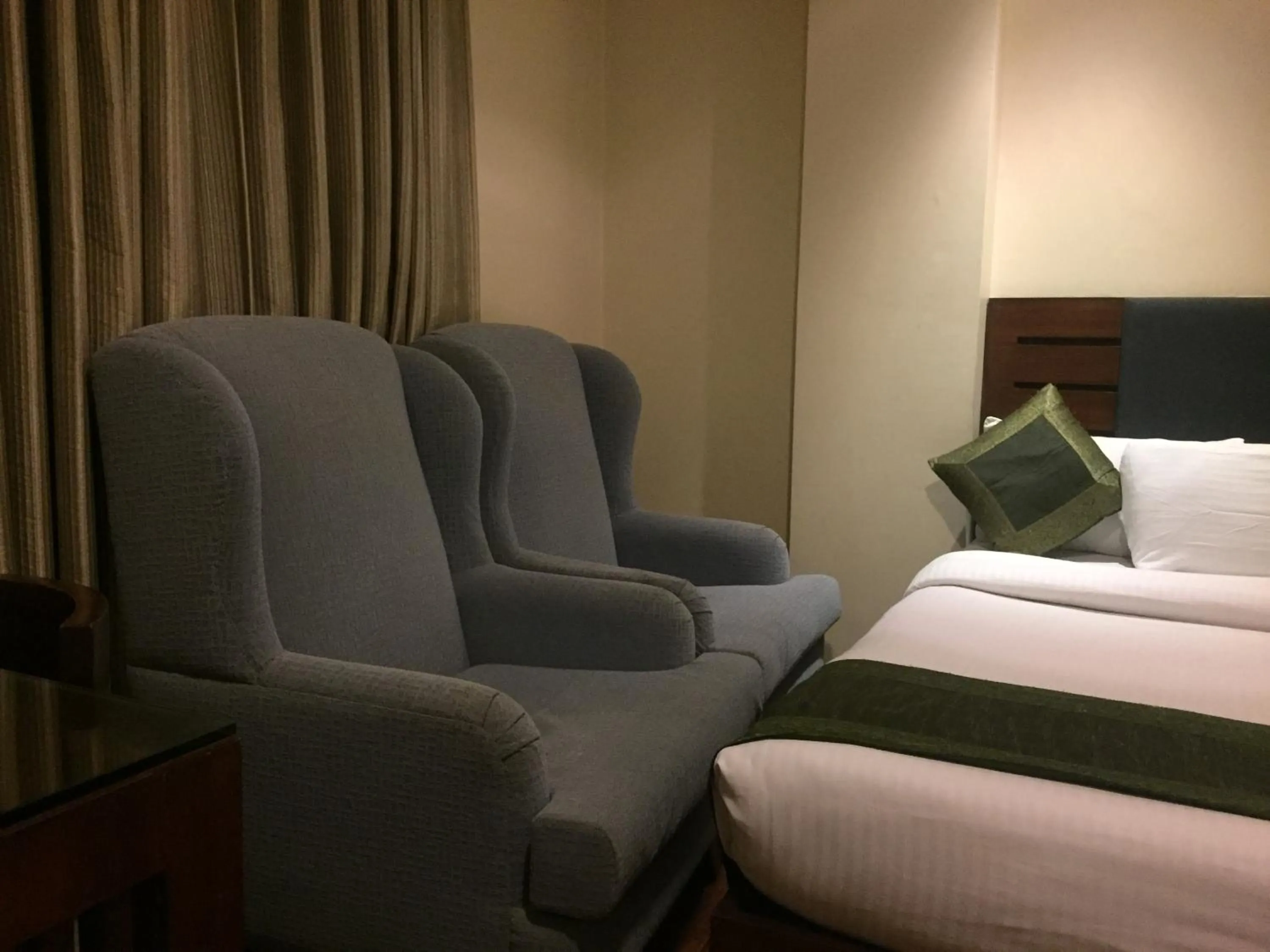 Seating area, Bed in Hotel Aura Near Connaught Place