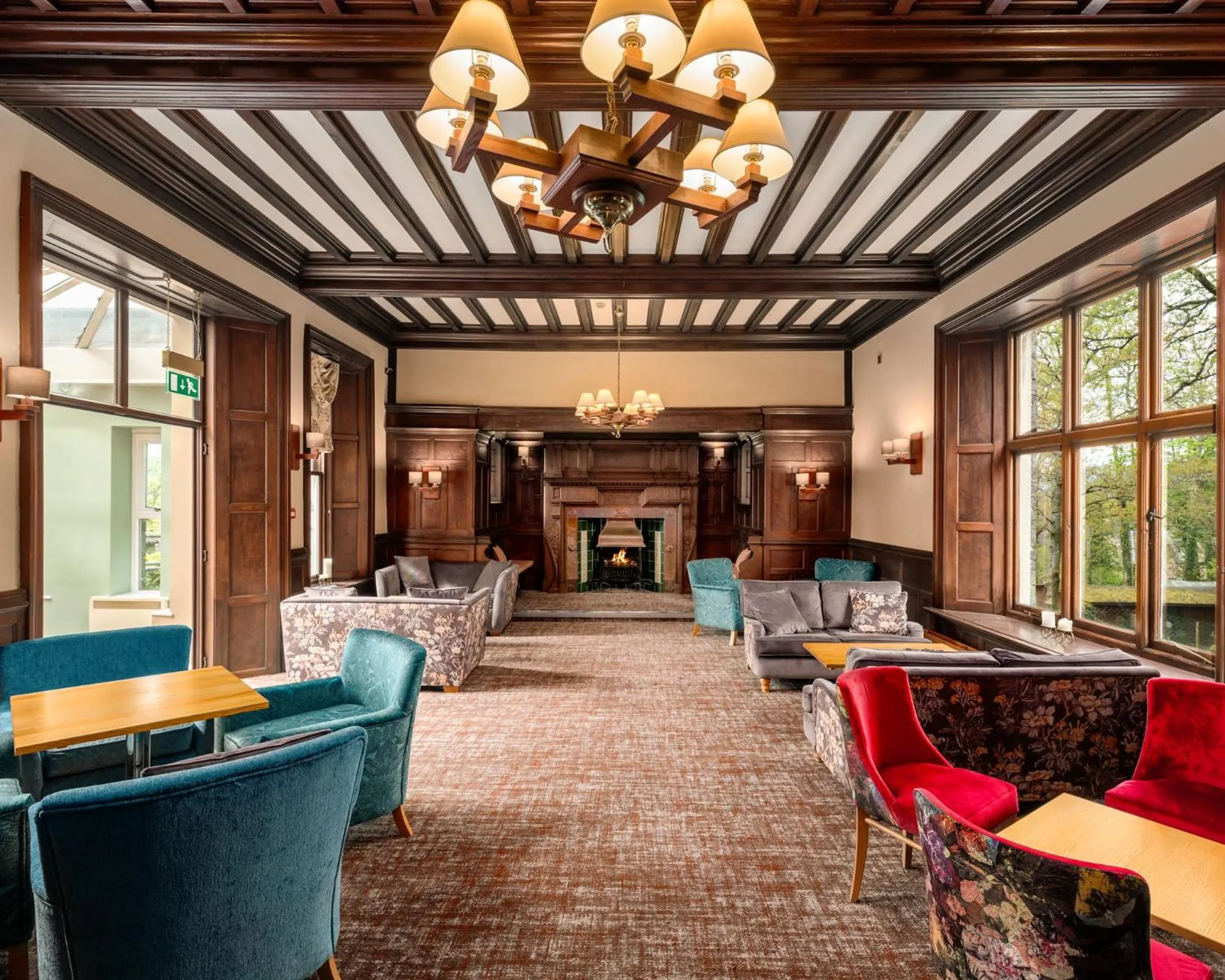 Communal lounge/ TV room in Windermere Manor Hotel