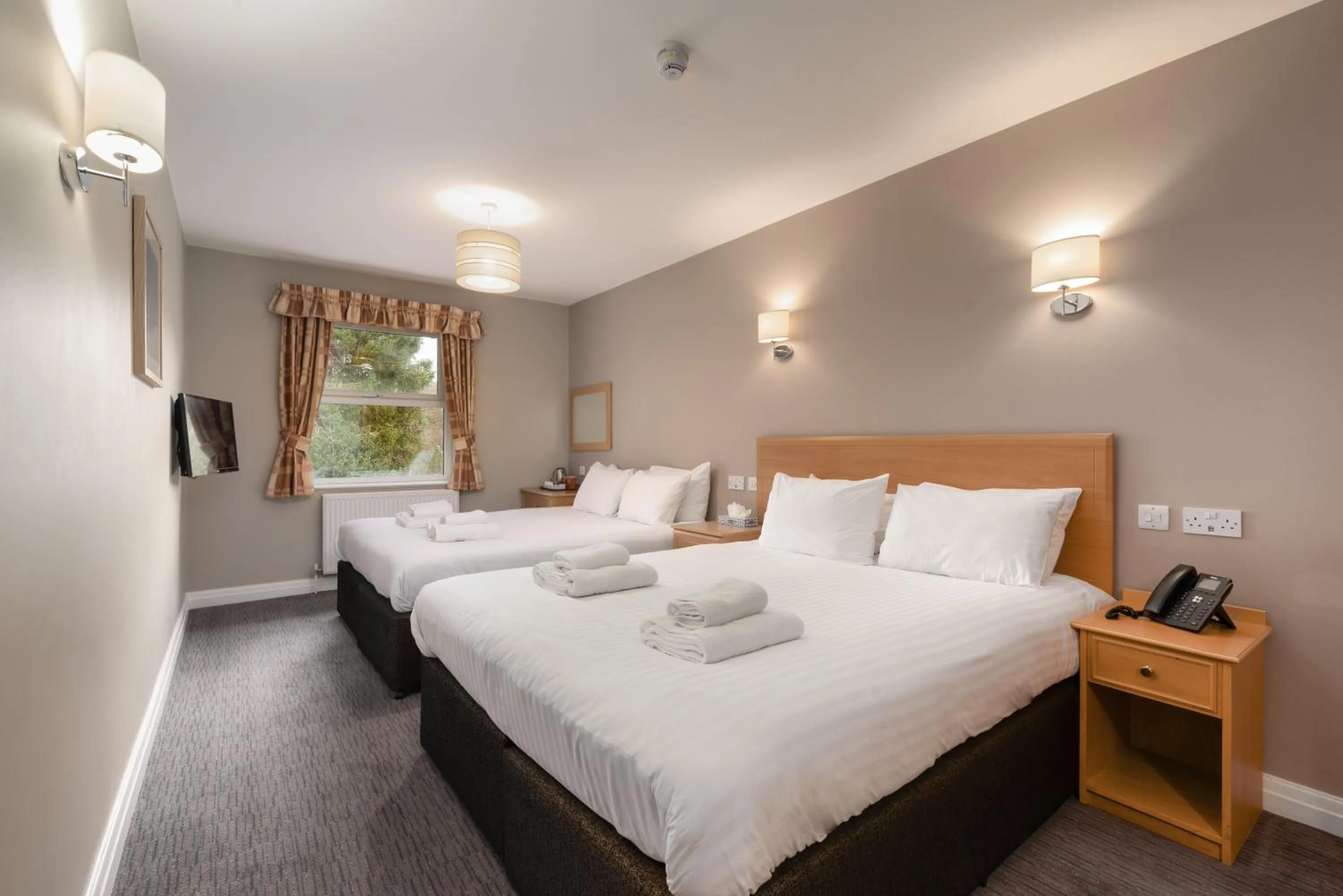 Bed in Windermere Manor Hotel