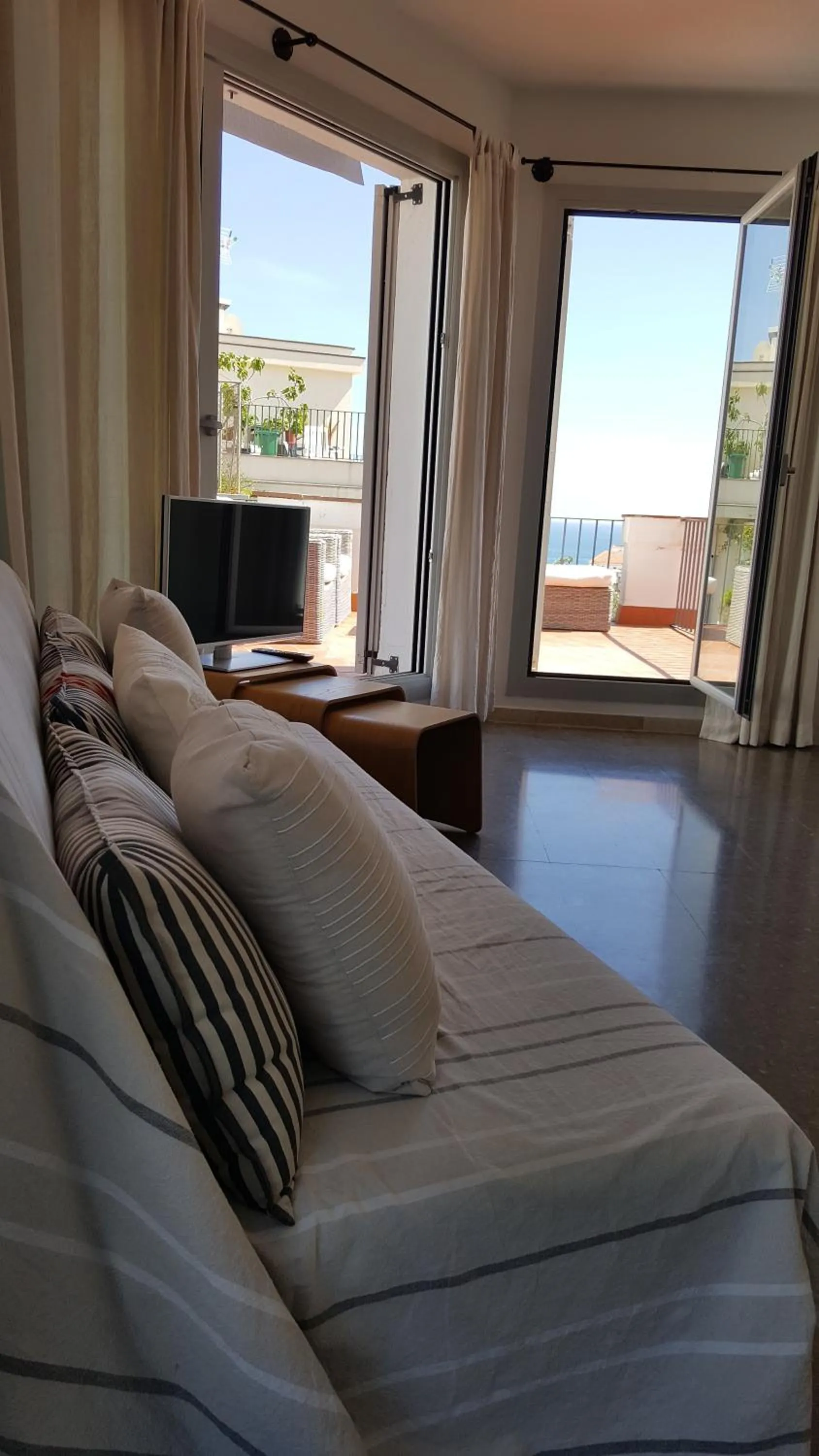 Communal lounge/ TV room in The Sky Attic Apartment