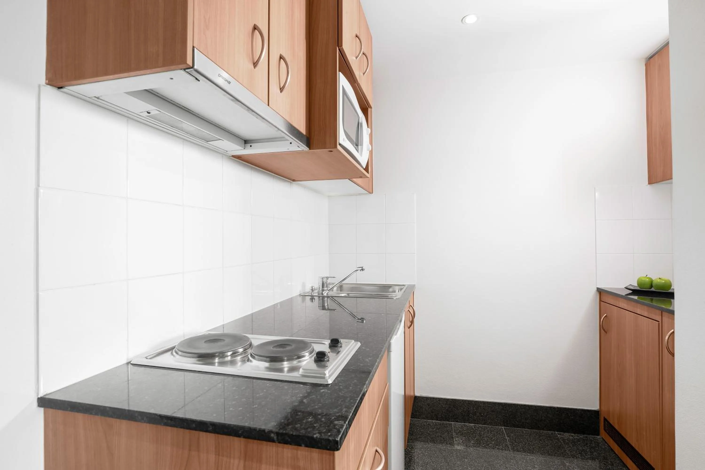 Kitchen or kitchenette in Mantra Parramatta