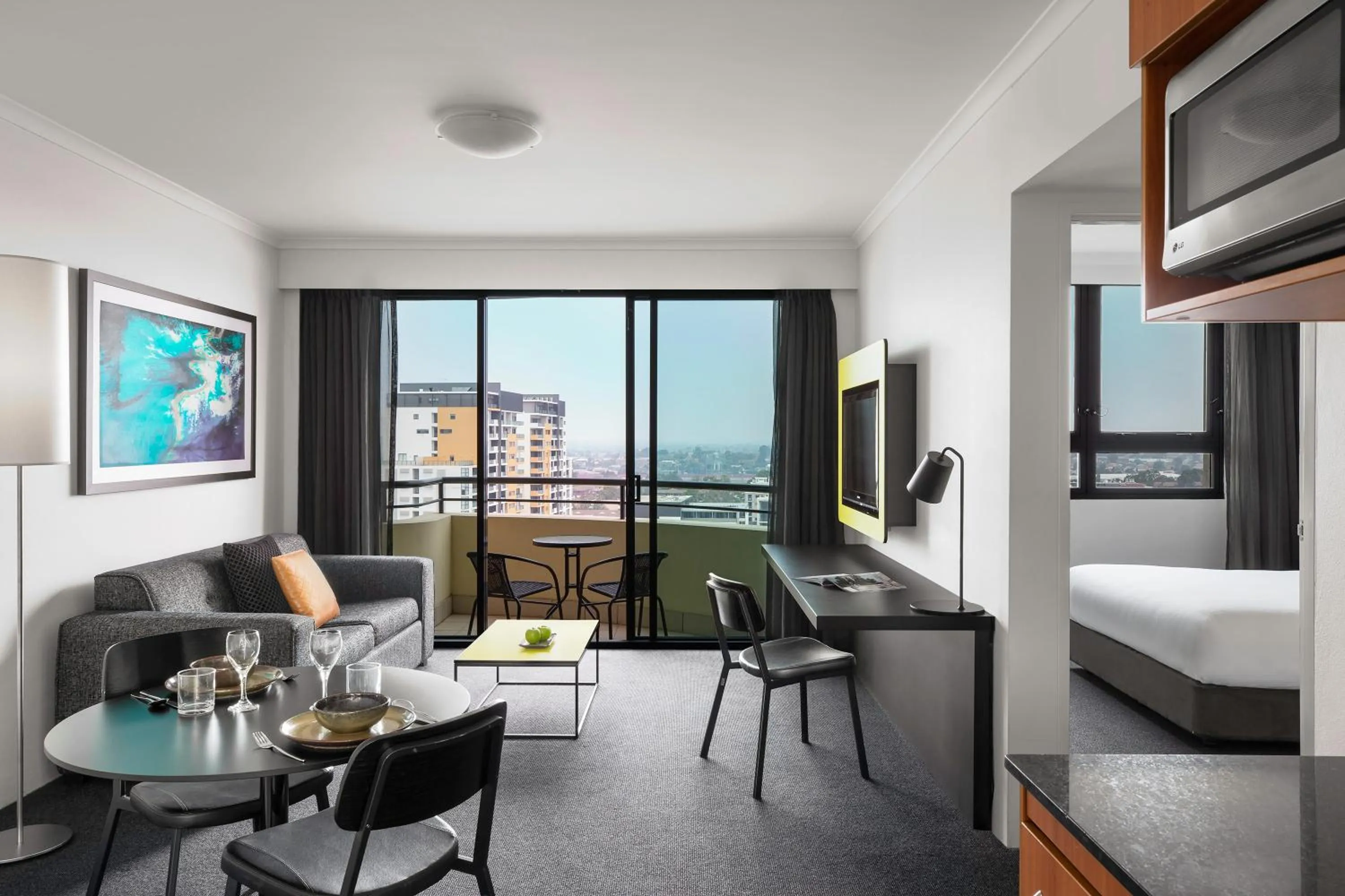 Living room, Bed in Mantra Parramatta