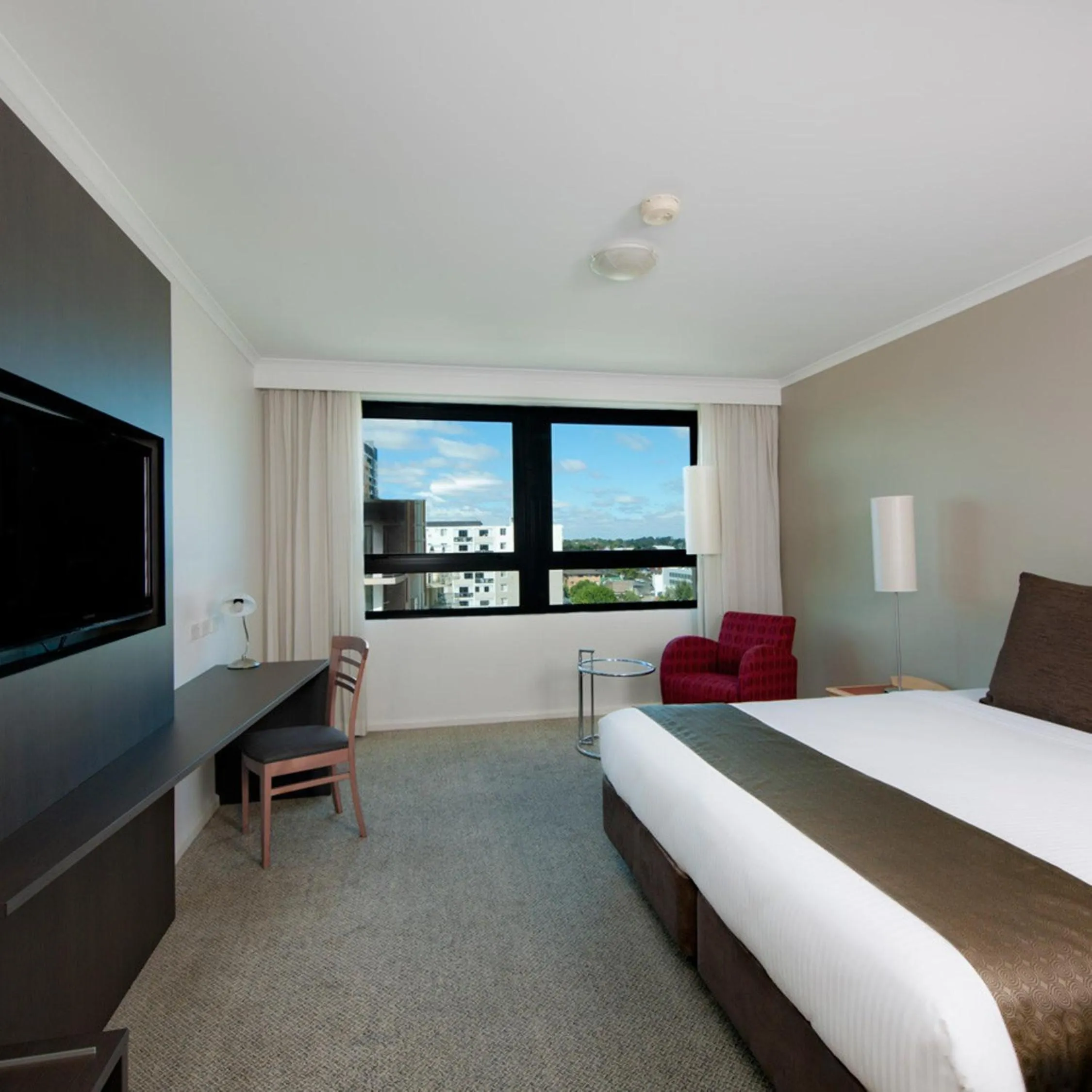 Seating area, Bed in Mantra Parramatta