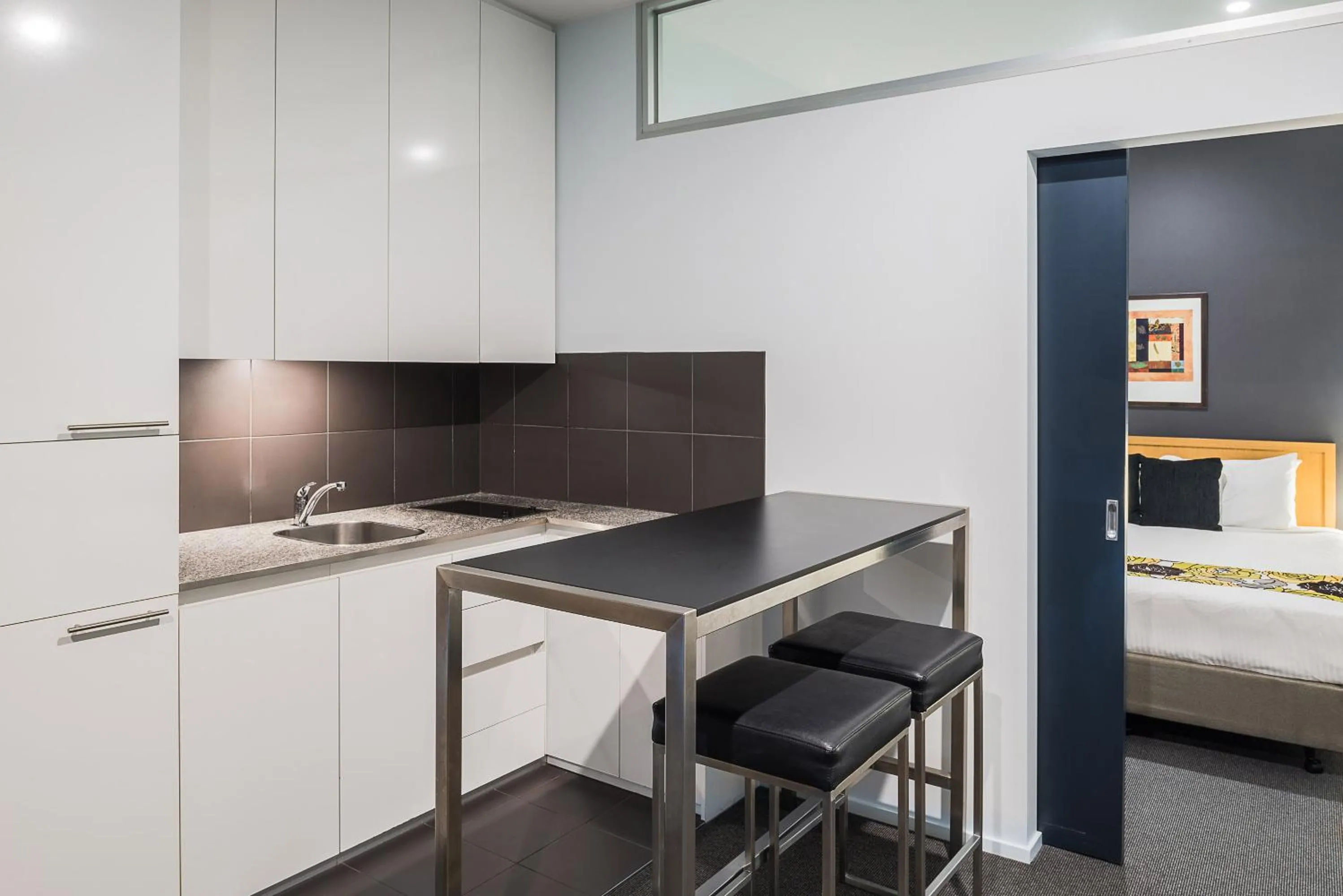 Kitchen or kitchenette, Bed in Mantra 100 Exhibition