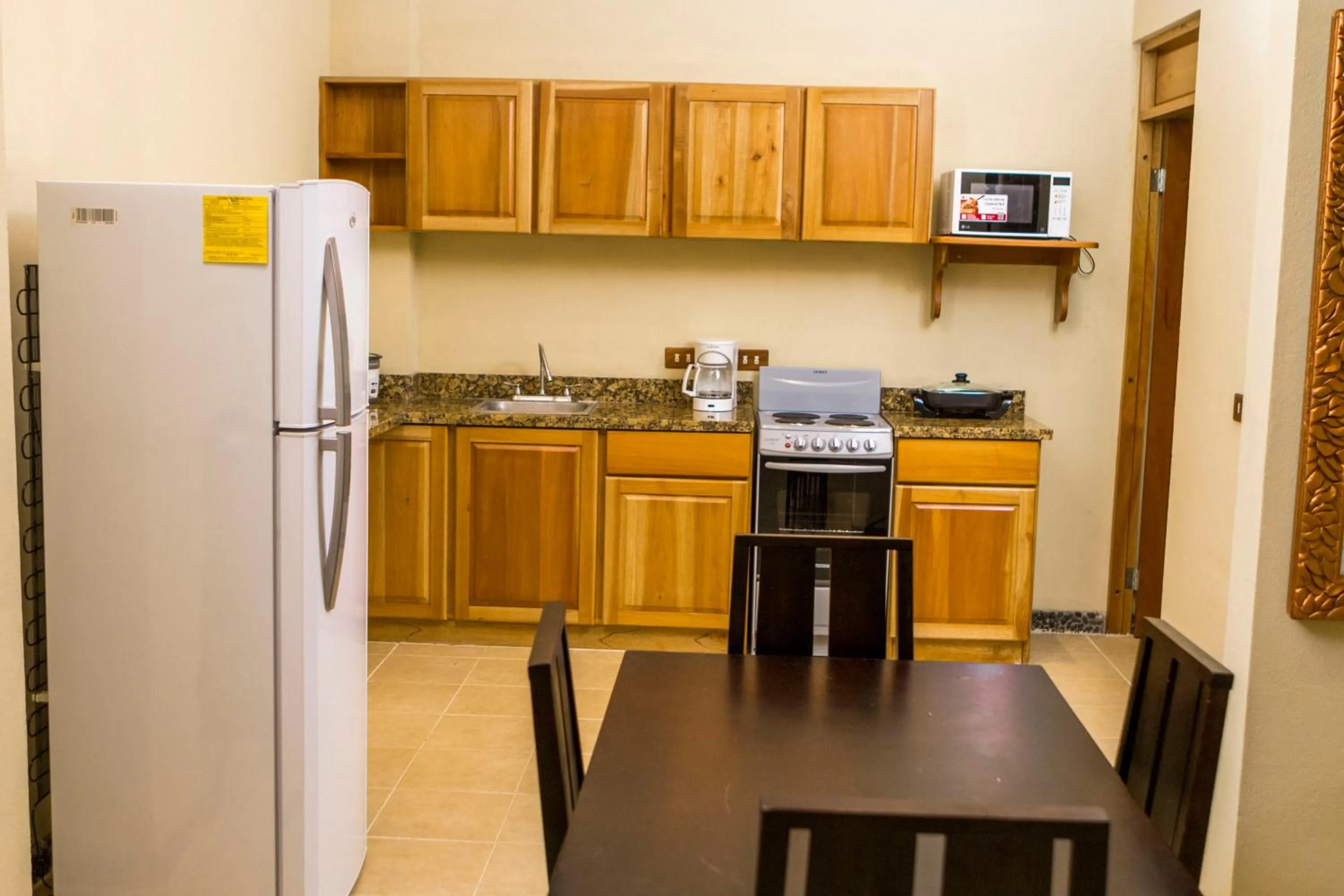 Kitchen or kitchenette in Pacifico Loft Hotel