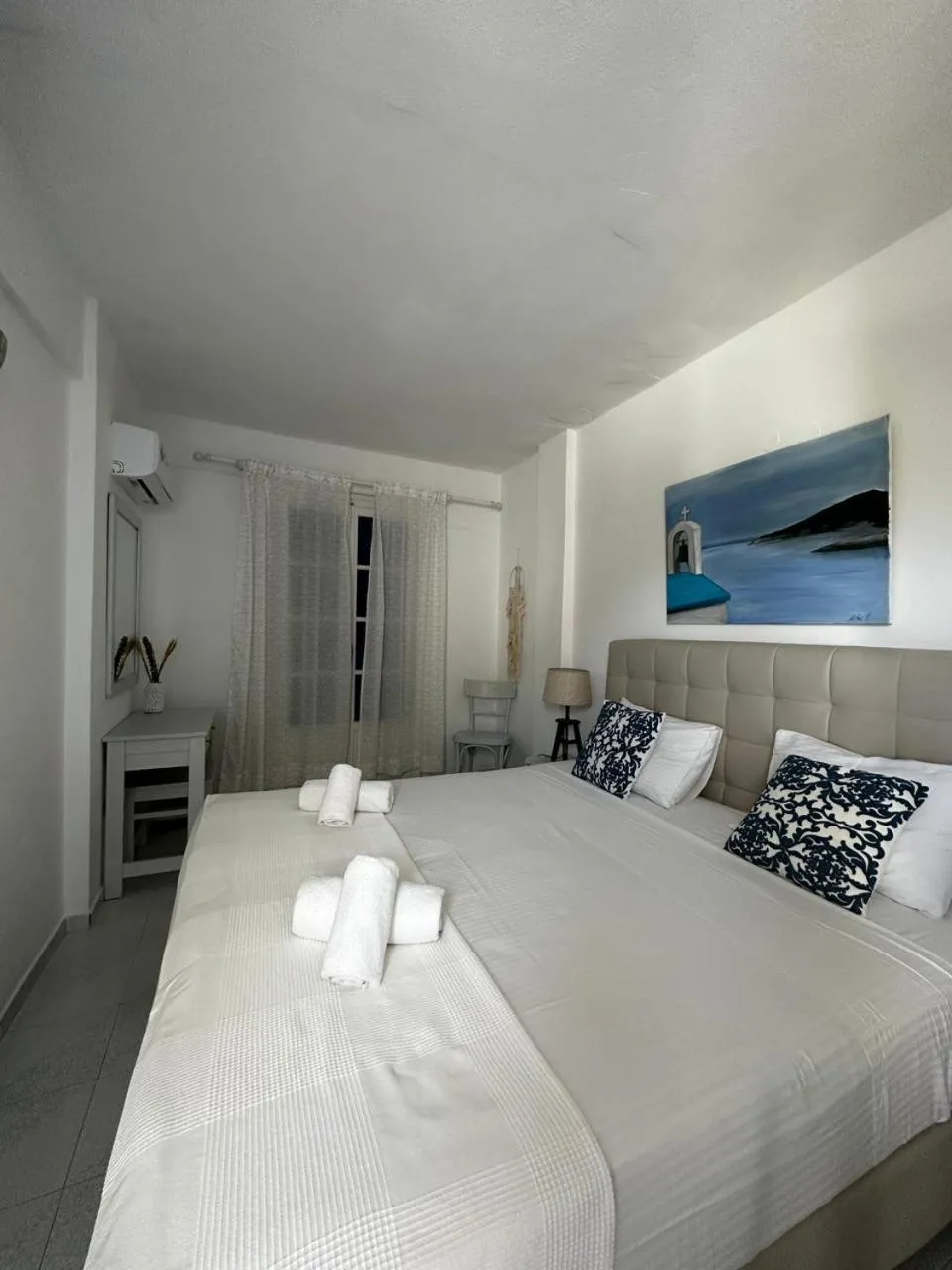 Bedroom in Εvi Evan Hotel