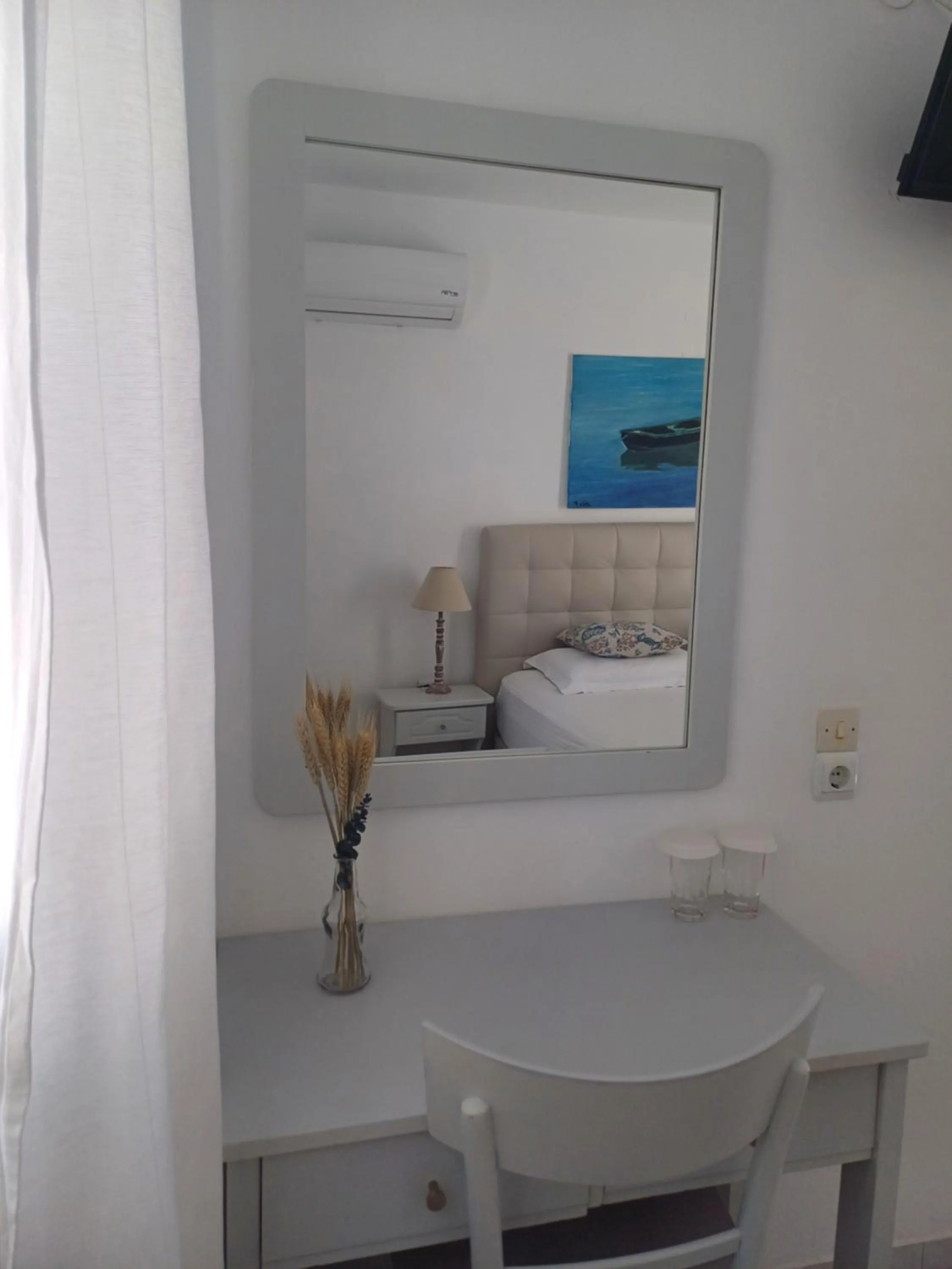 Bedroom in Εvi Evan Hotel