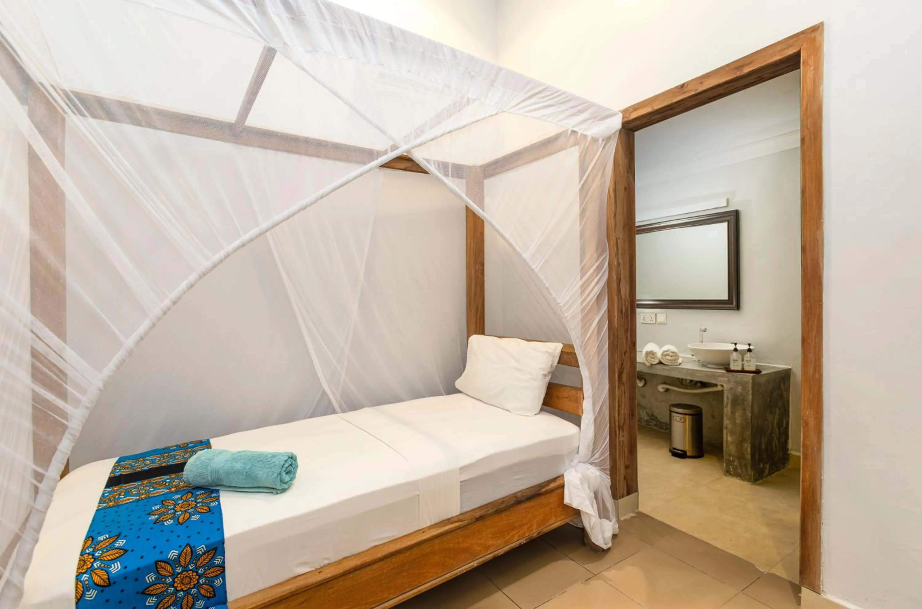 Bed in Paje Beach Apartments & Hotel