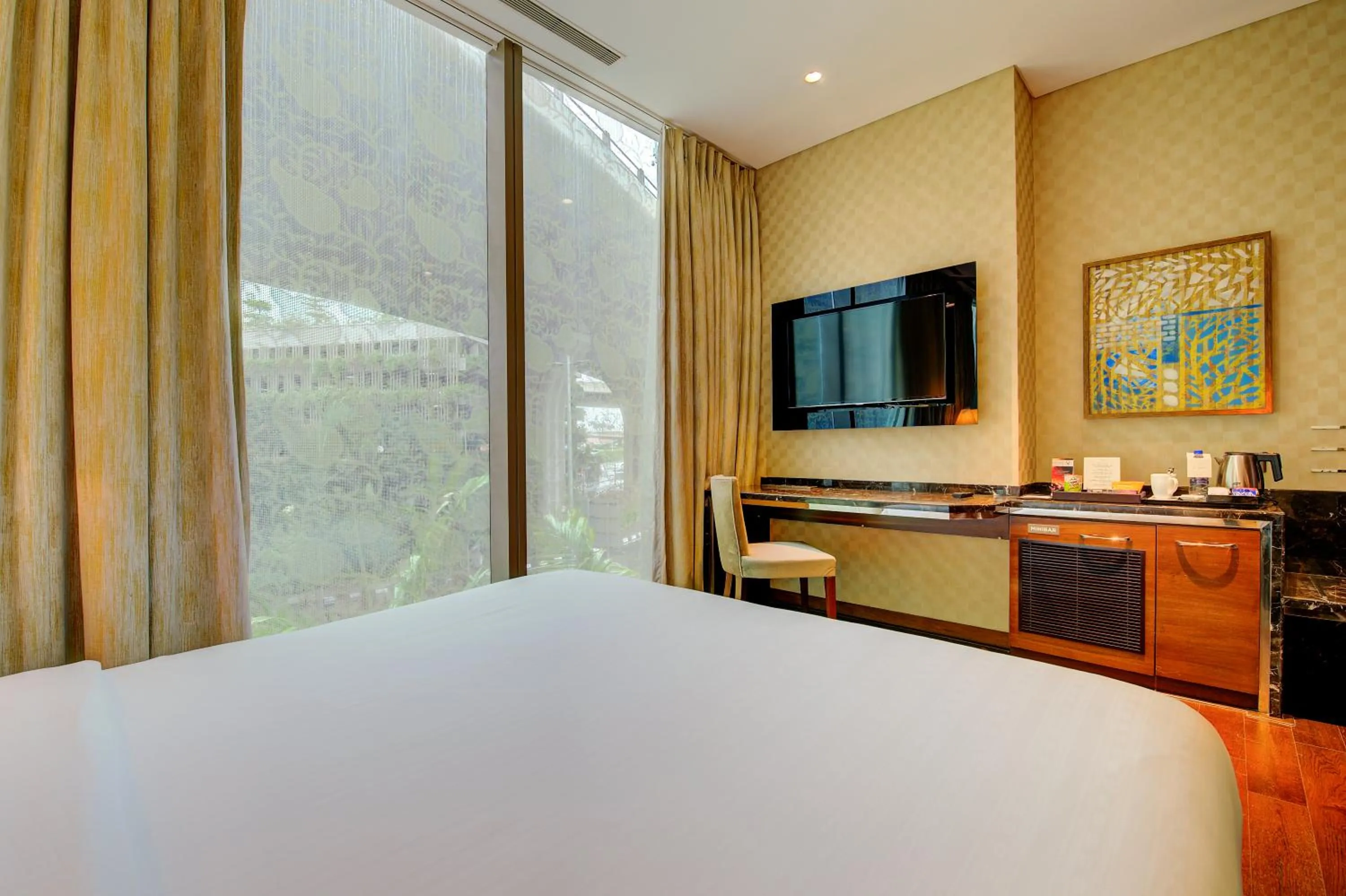 Photo of the whole room, Bed in Niranta Transit Hotel Mumbai Airport - At Arrivals