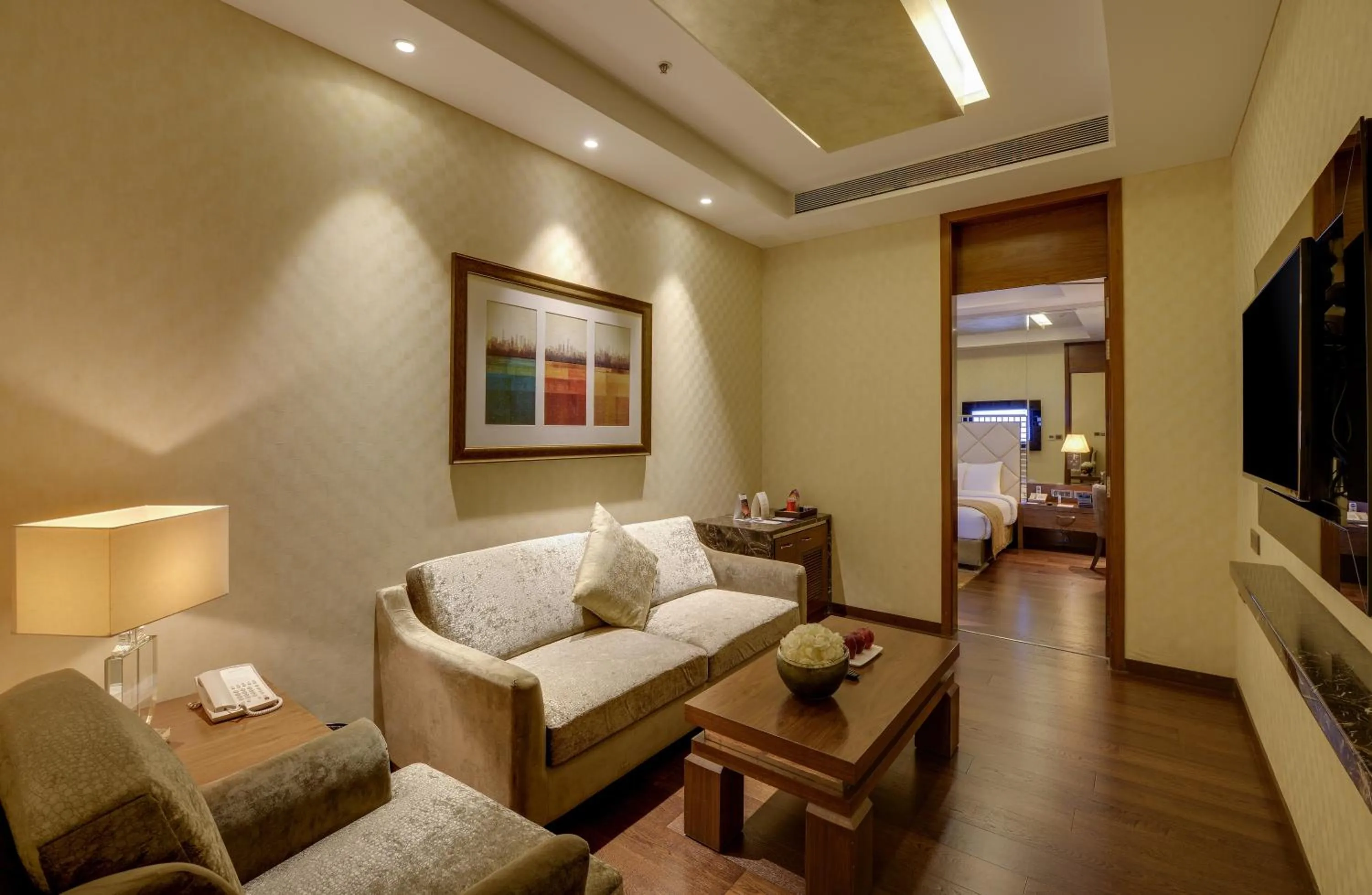 Living room, Bed in Niranta Transit Hotel Mumbai Airport - At Arrivals