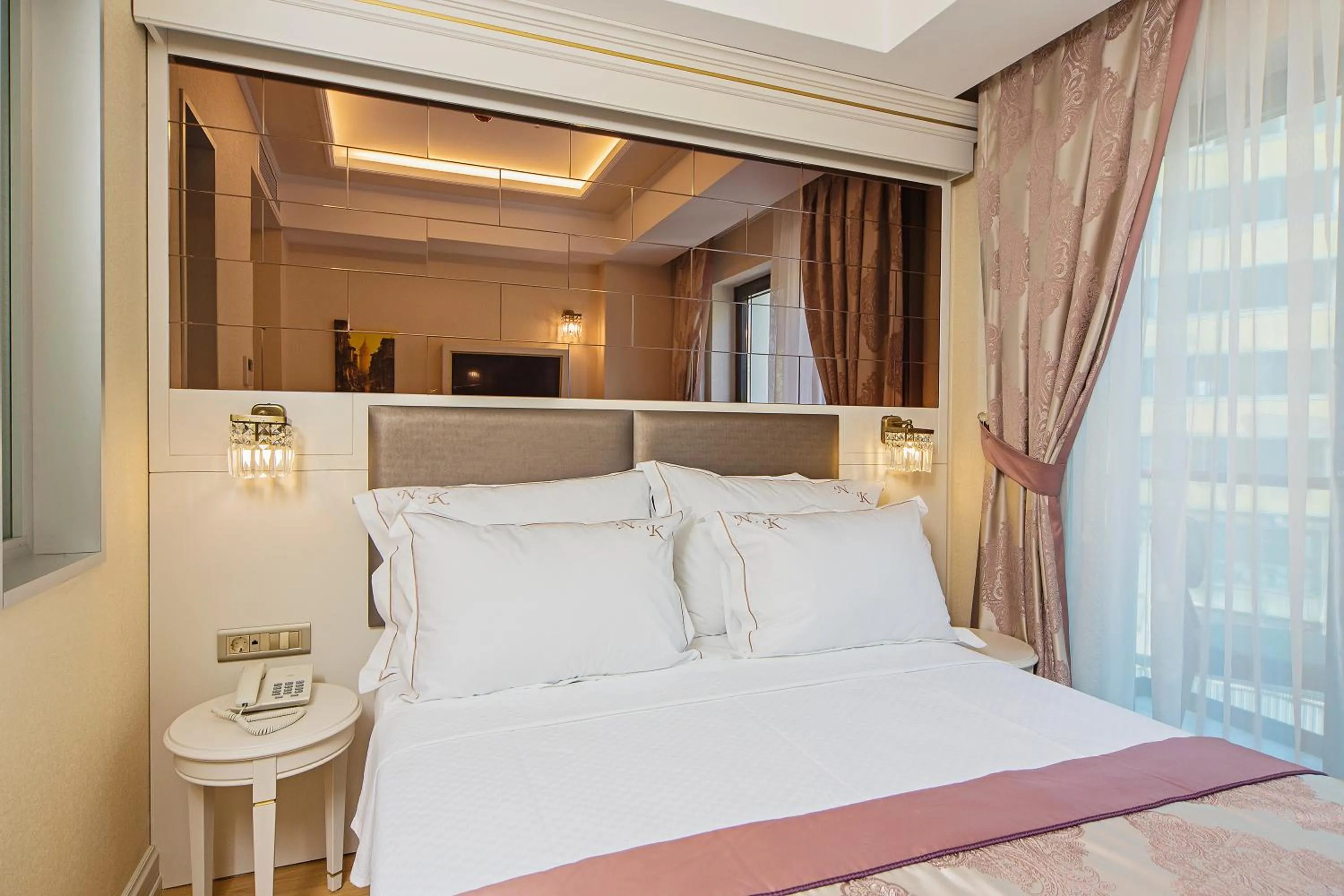 Bed in Grand Naki Hotel