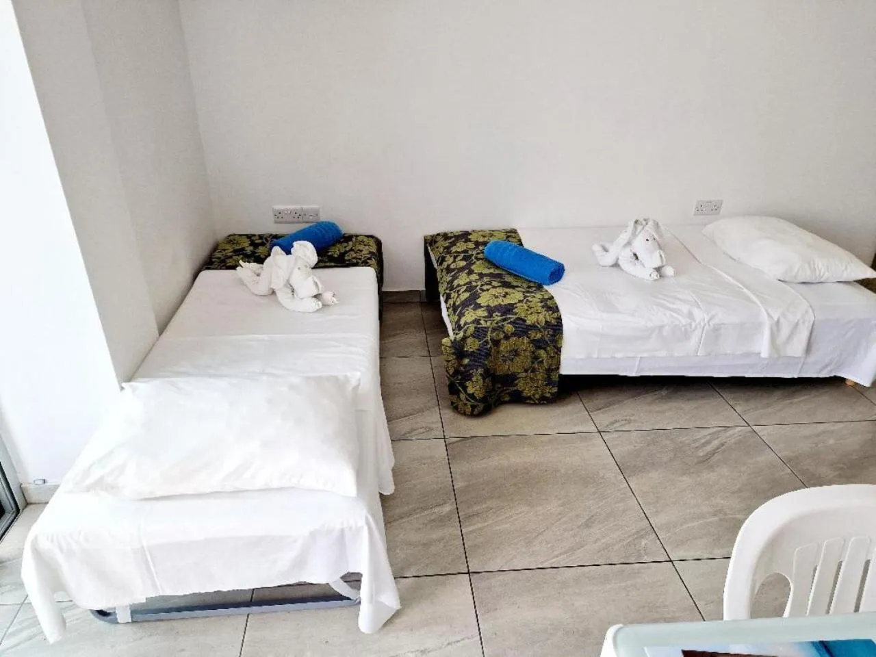 Bed in Christopher's Sandy Beach Suites