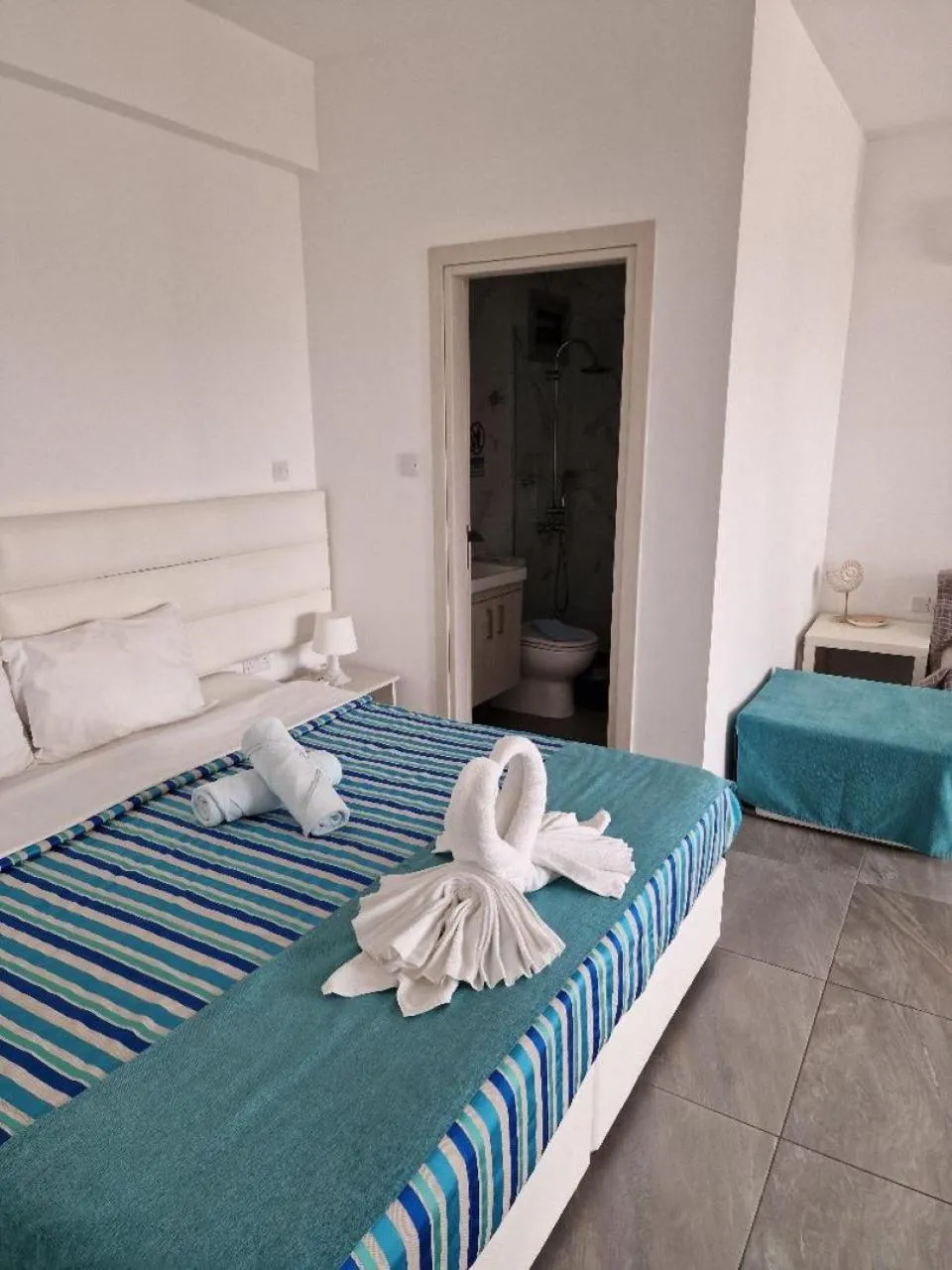 Bed in Christopher's Sandy Beach Suites