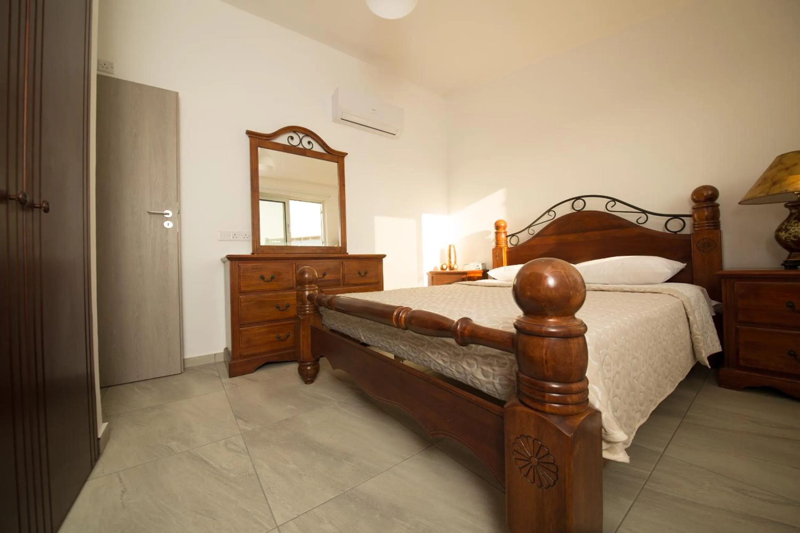 Bed in Christopher's Sandy Beach Suites