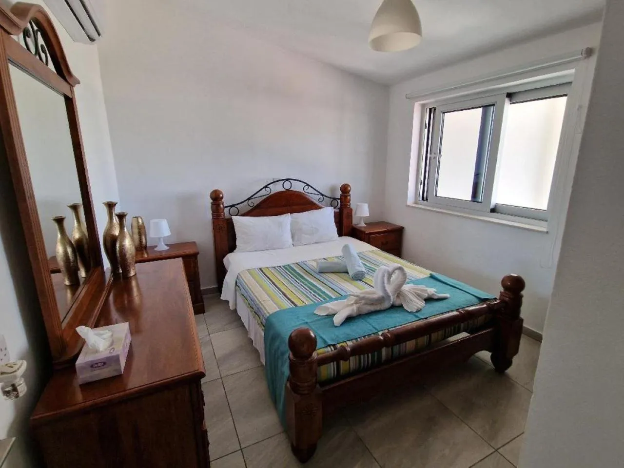 Bed in Christopher's Sandy Beach Suites