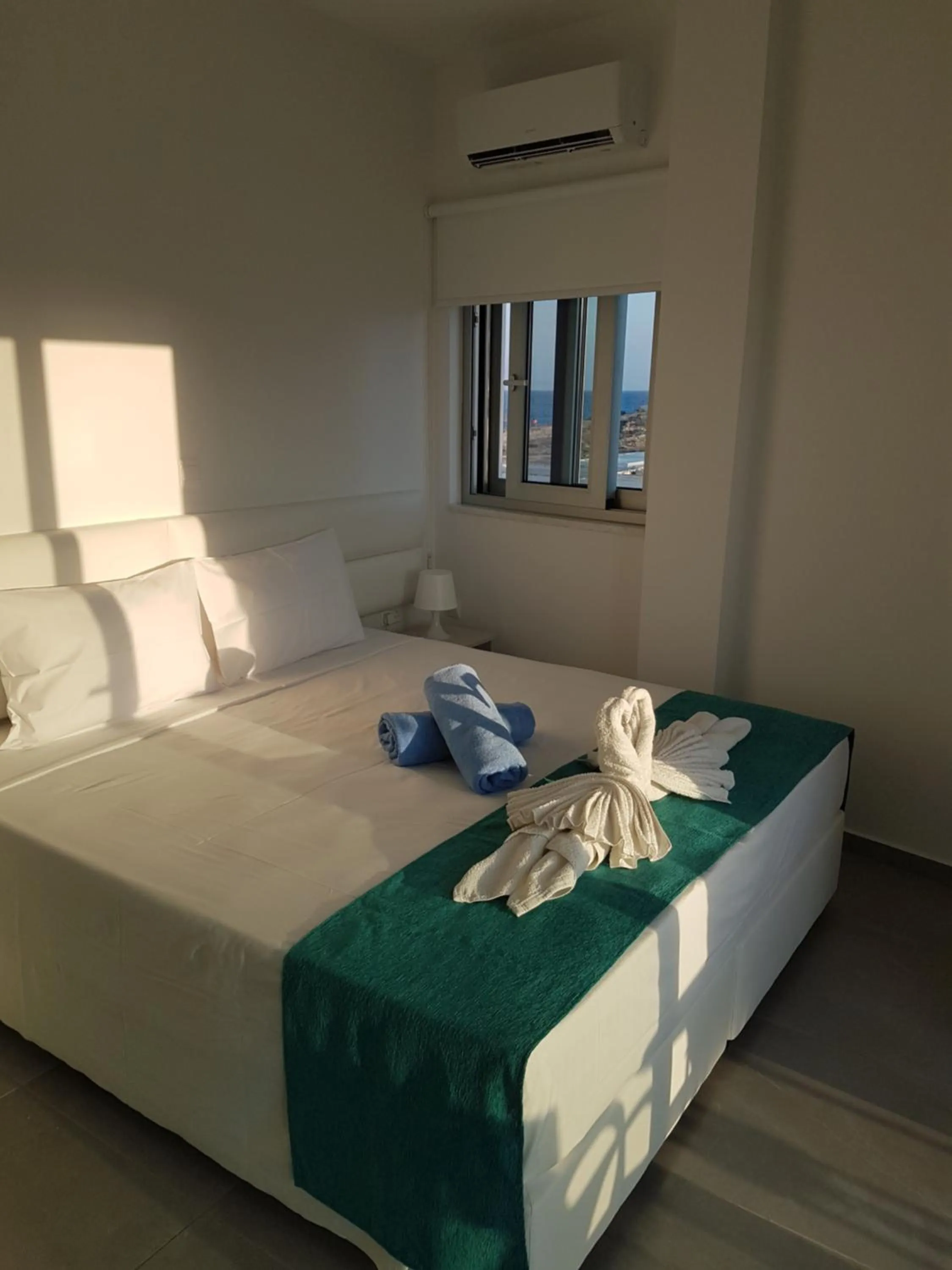 Bed in Christopher's Sandy Beach Suites