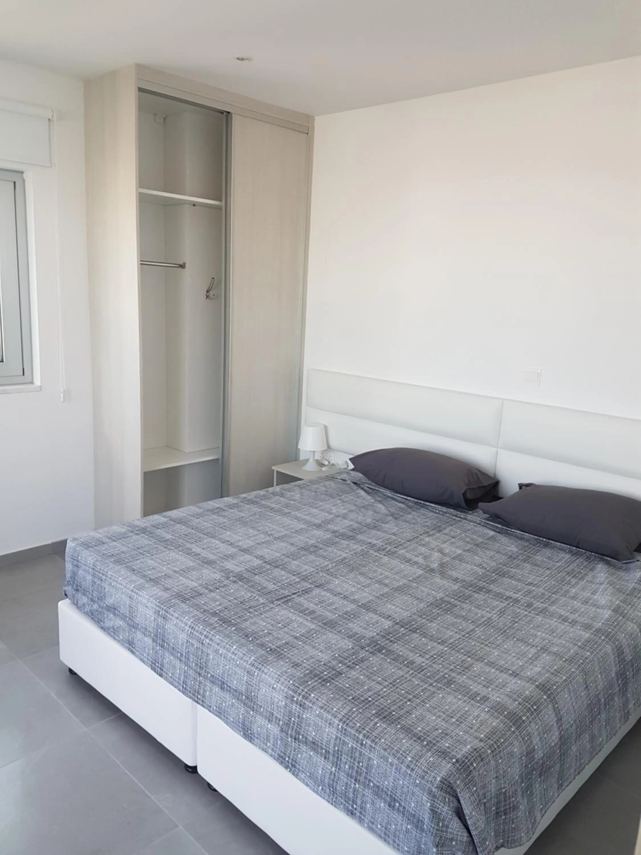 Bed in Christopher's Sandy Beach Suites