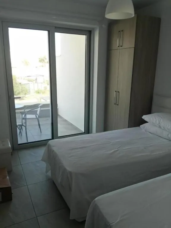 Bed in Christopher's Sandy Beach Suites