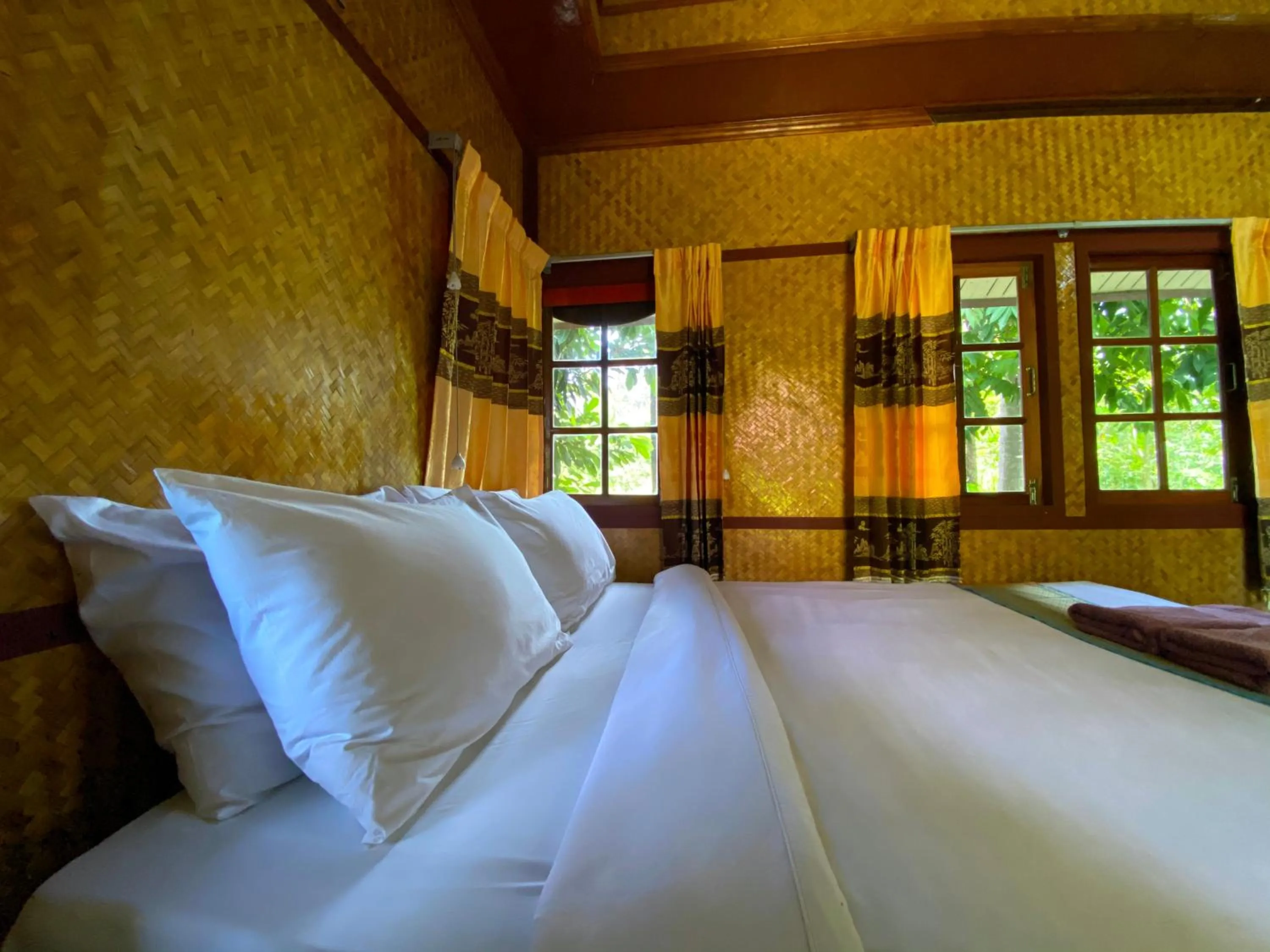 Bed in Everest Resort Samui - SHA Plus