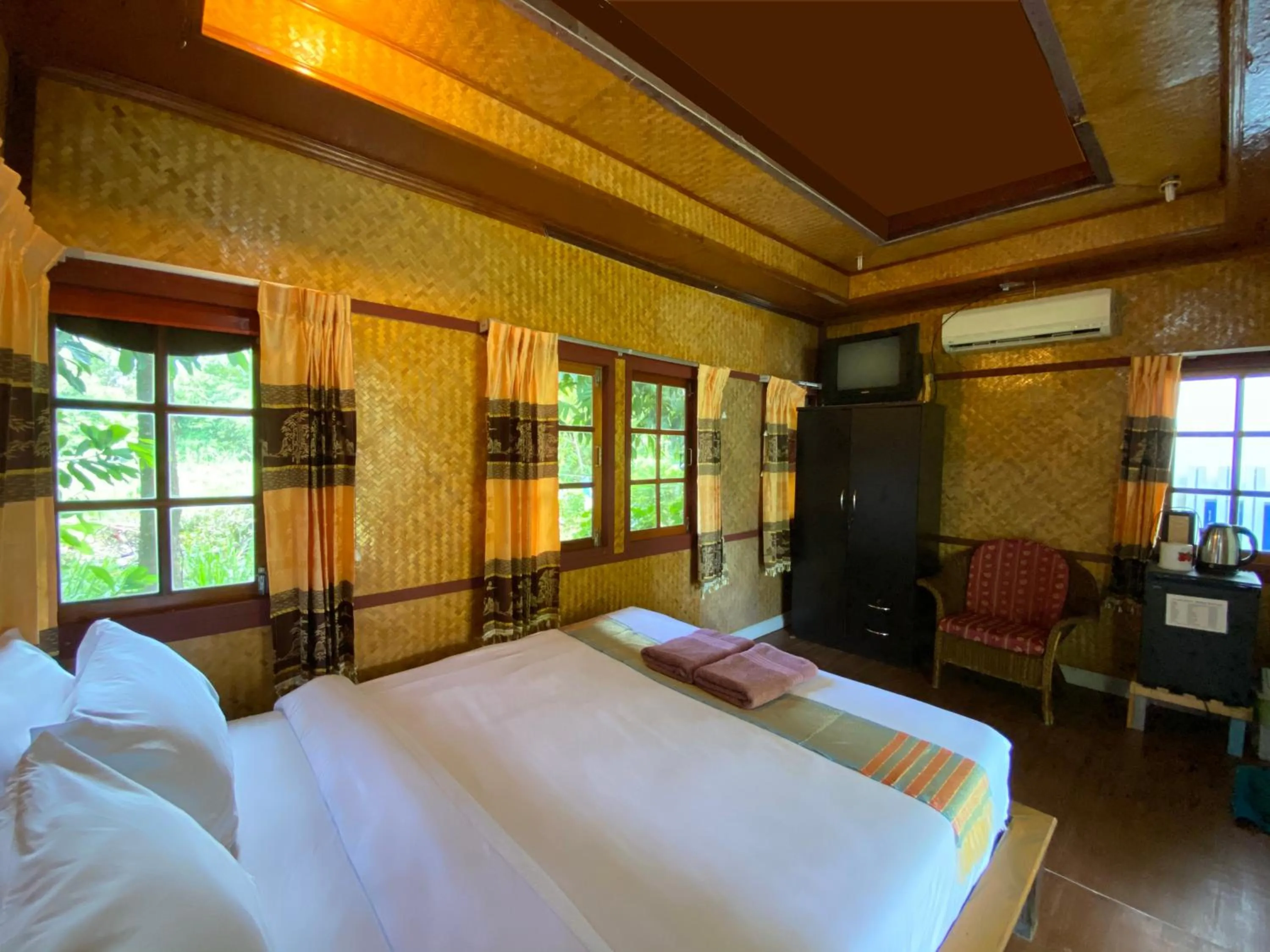 Bed in Everest Resort Samui - SHA Plus