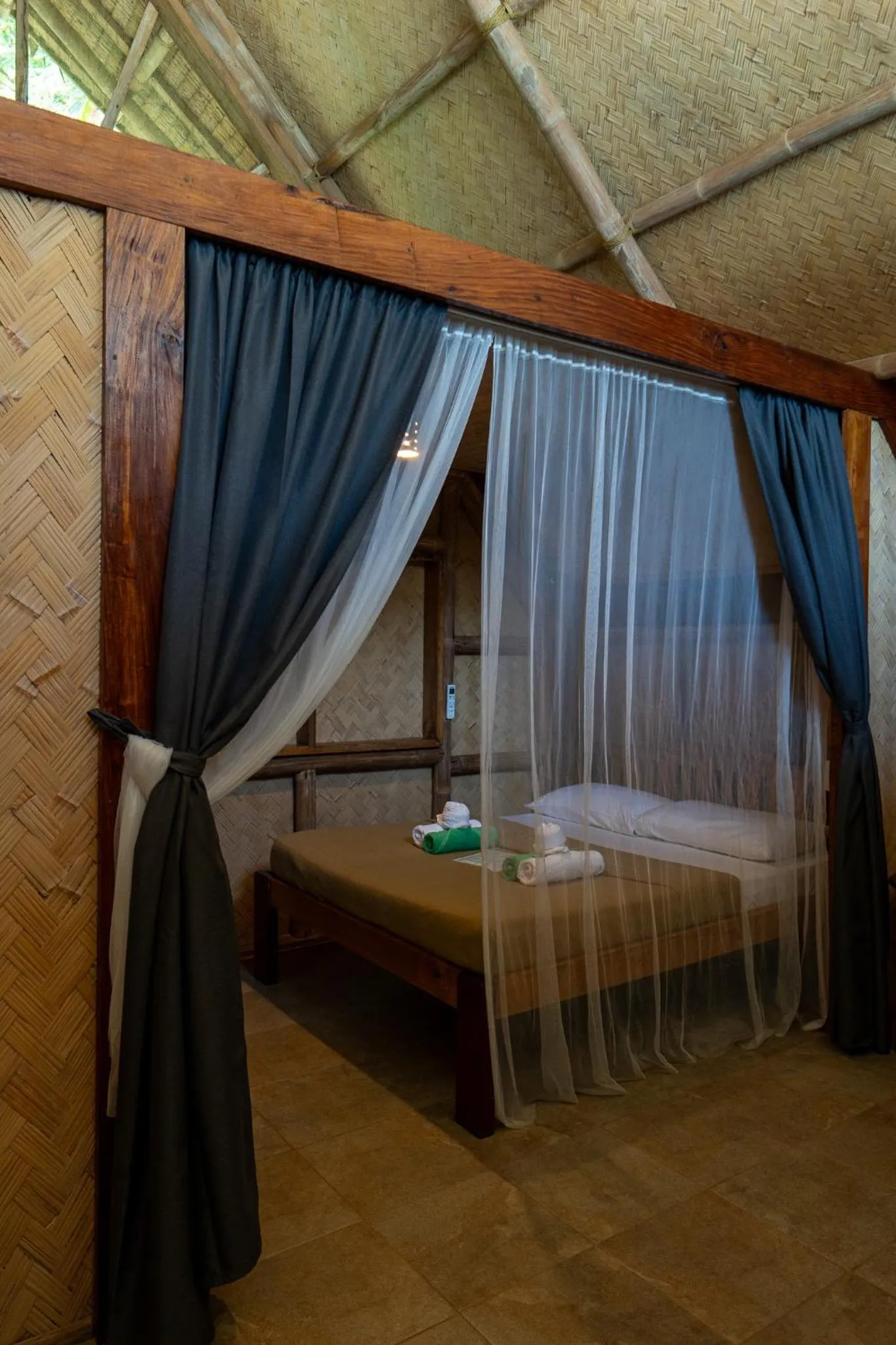 Bed in Sangat Island Dive Resort