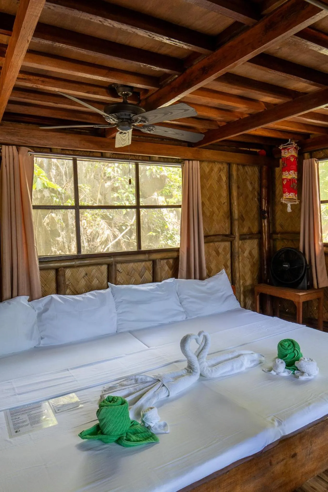 Bed in Sangat Island Dive Resort