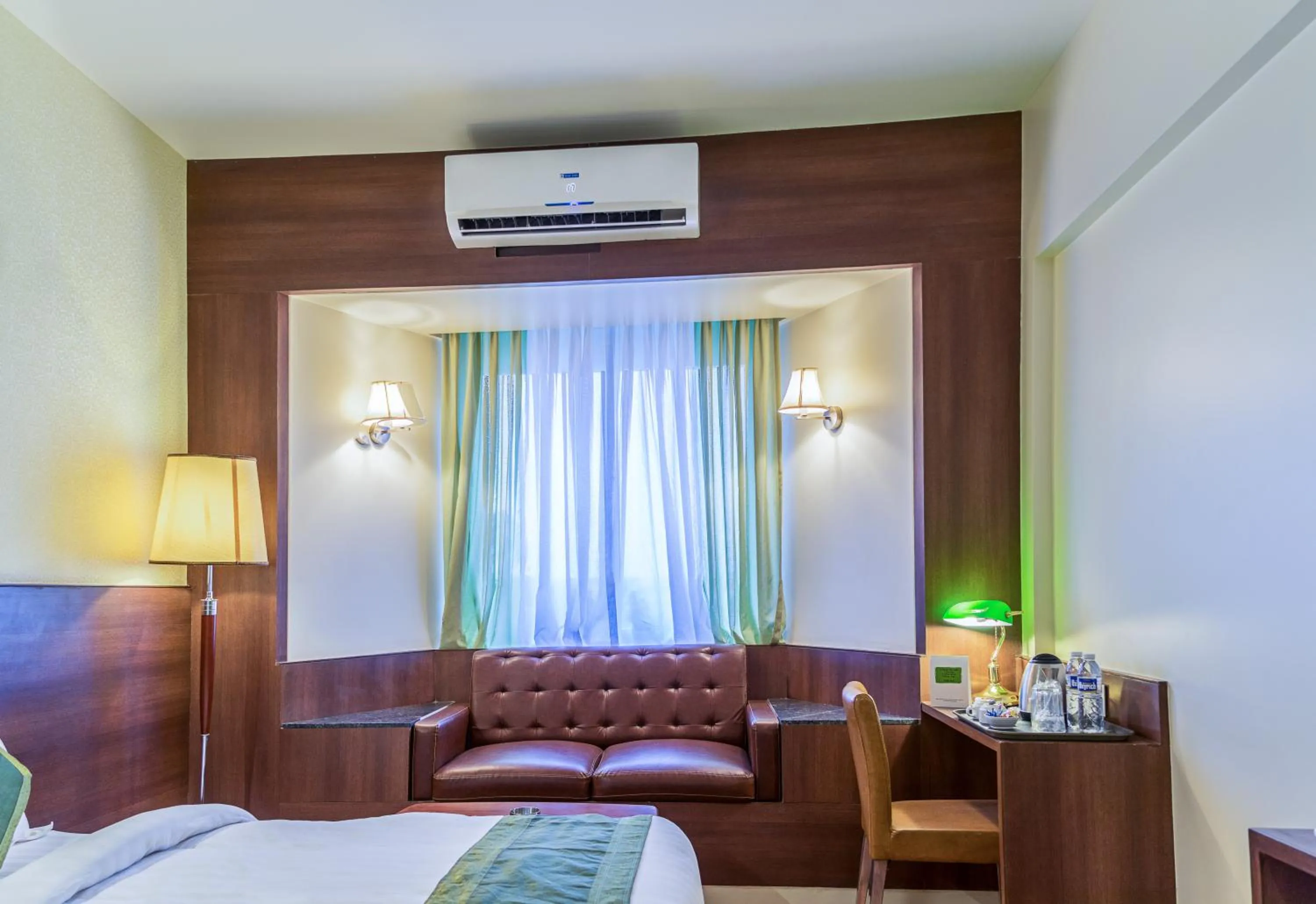 Bed in Treebo Premium Grand Emerald