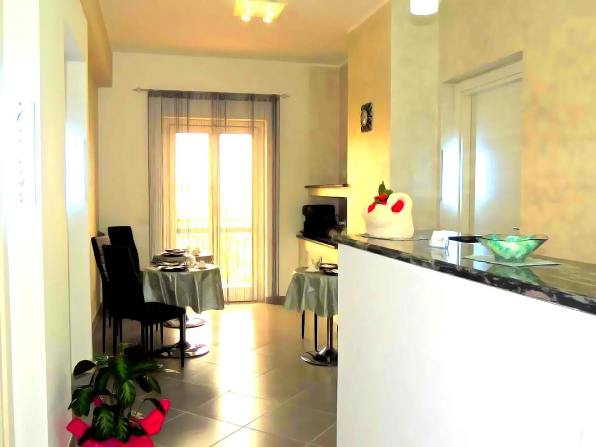 Communal lounge/ TV room in B&B Le Ninfe