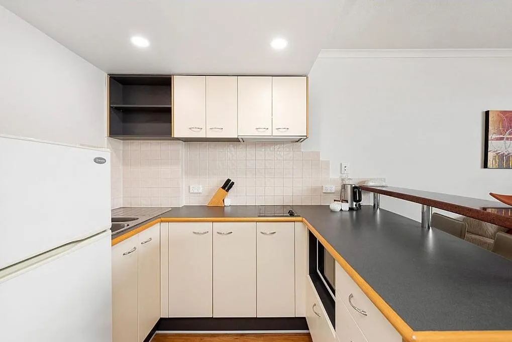 kitchen in Cosmo Apartment Hotel