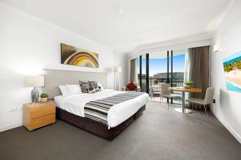 Bed in Cosmo Apartment Hotel