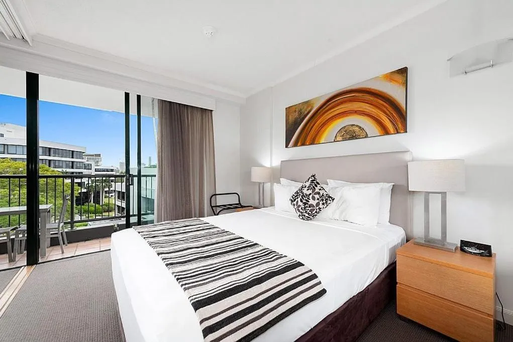 Bed in Cosmo Apartment Hotel