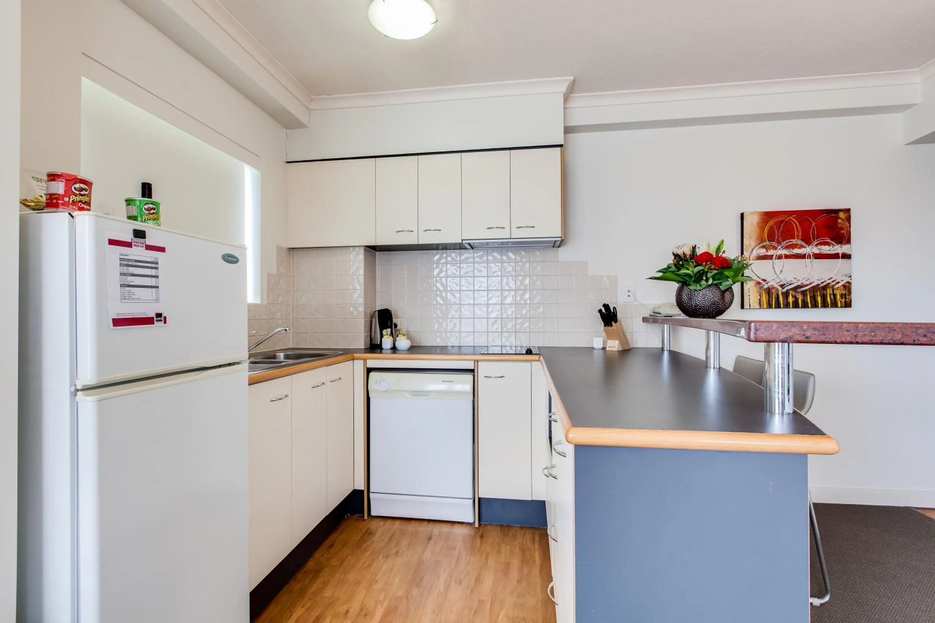 Kitchen or kitchenette in Cosmo Apartment Hotel