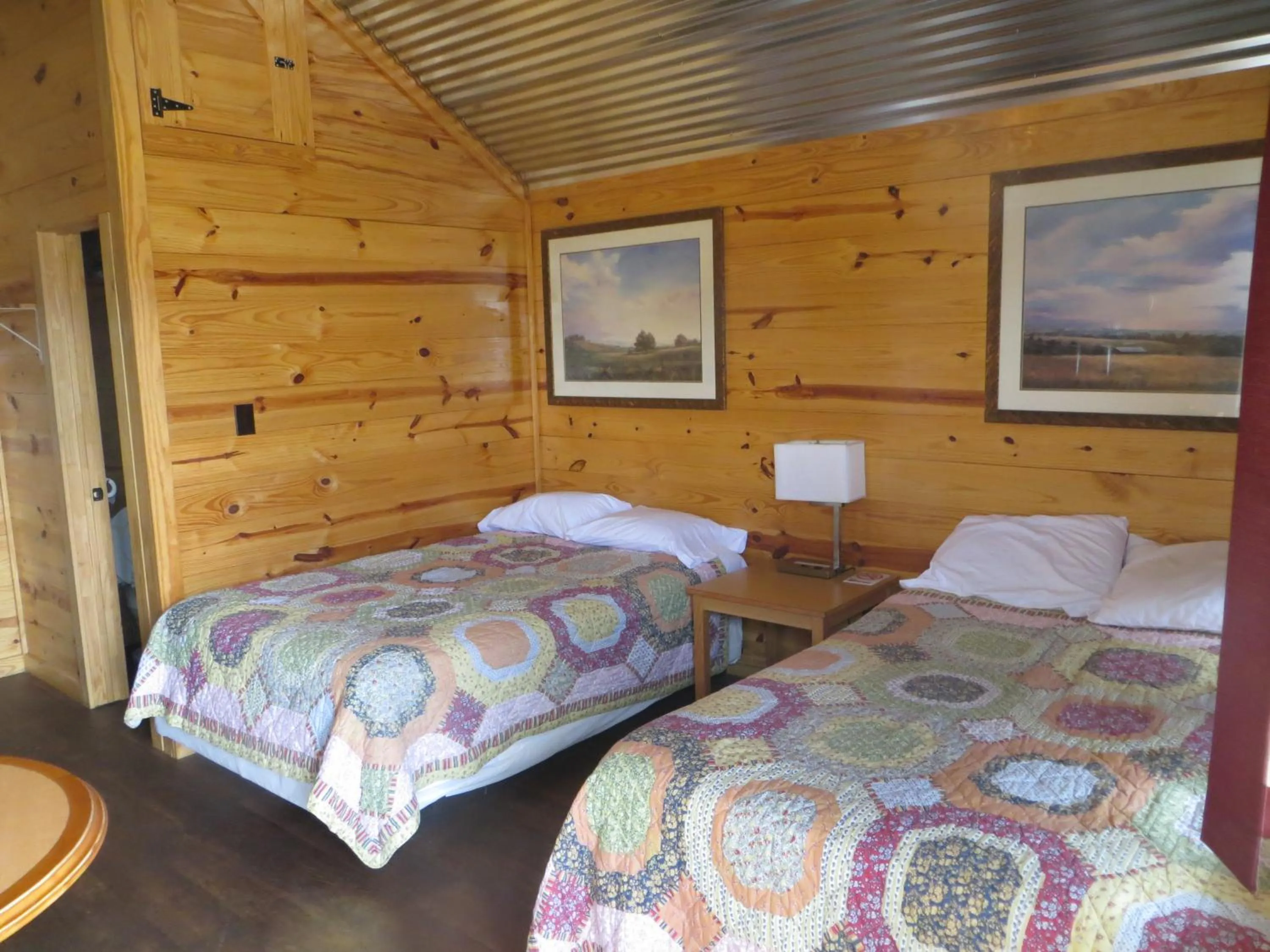 Bed in All Tucked Inn Cabins
