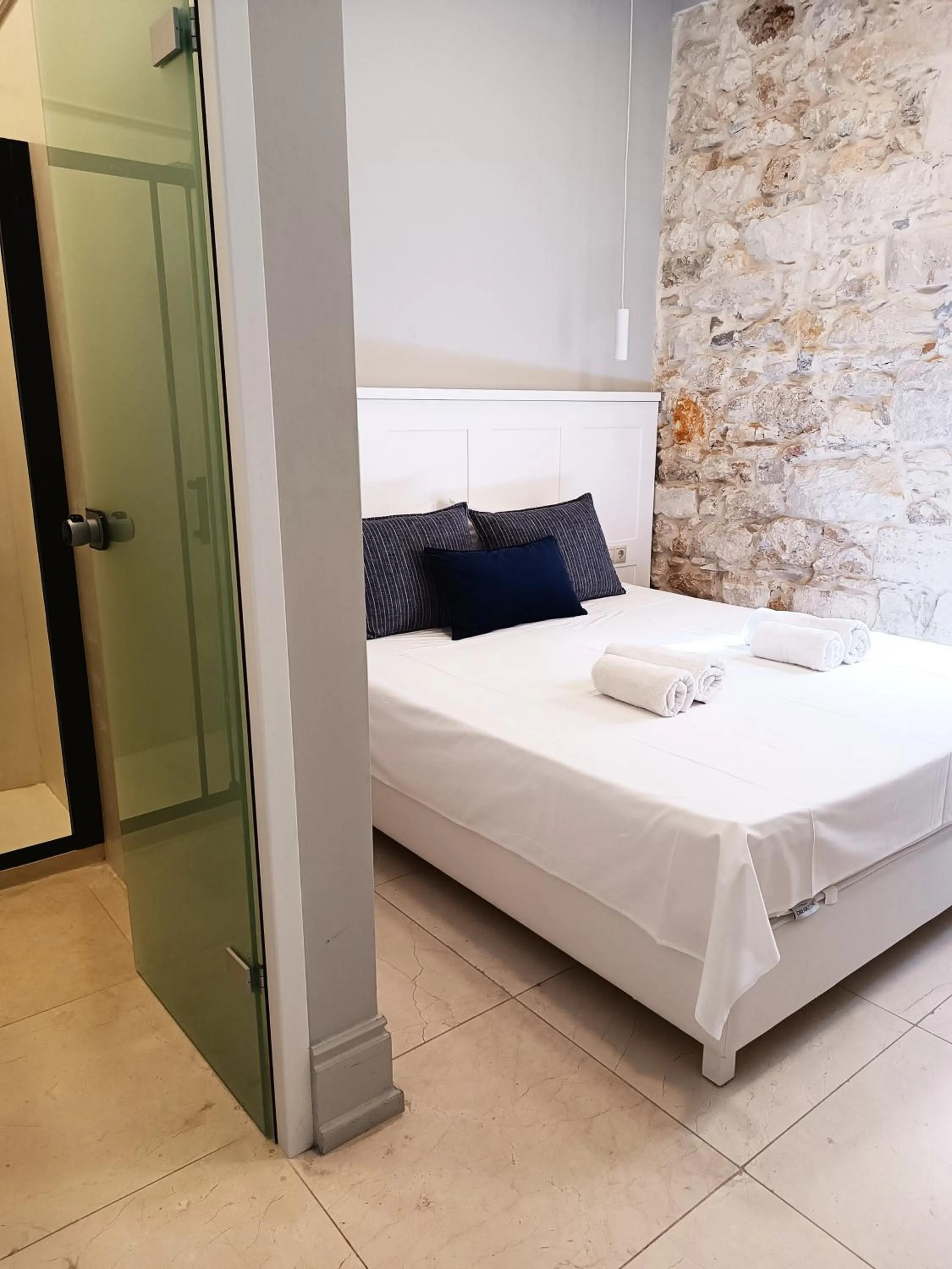 Bed in Candia Suites & Rooms