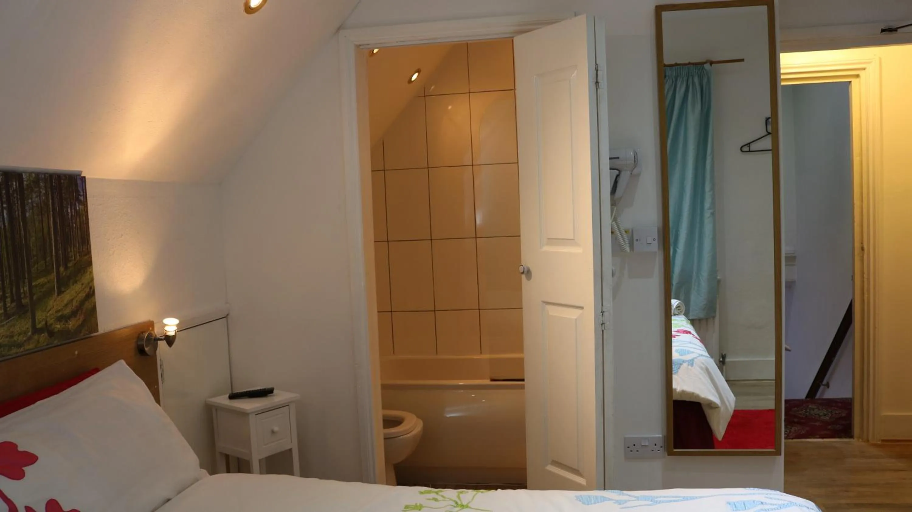 Toilet, Bed in Anand Lodge