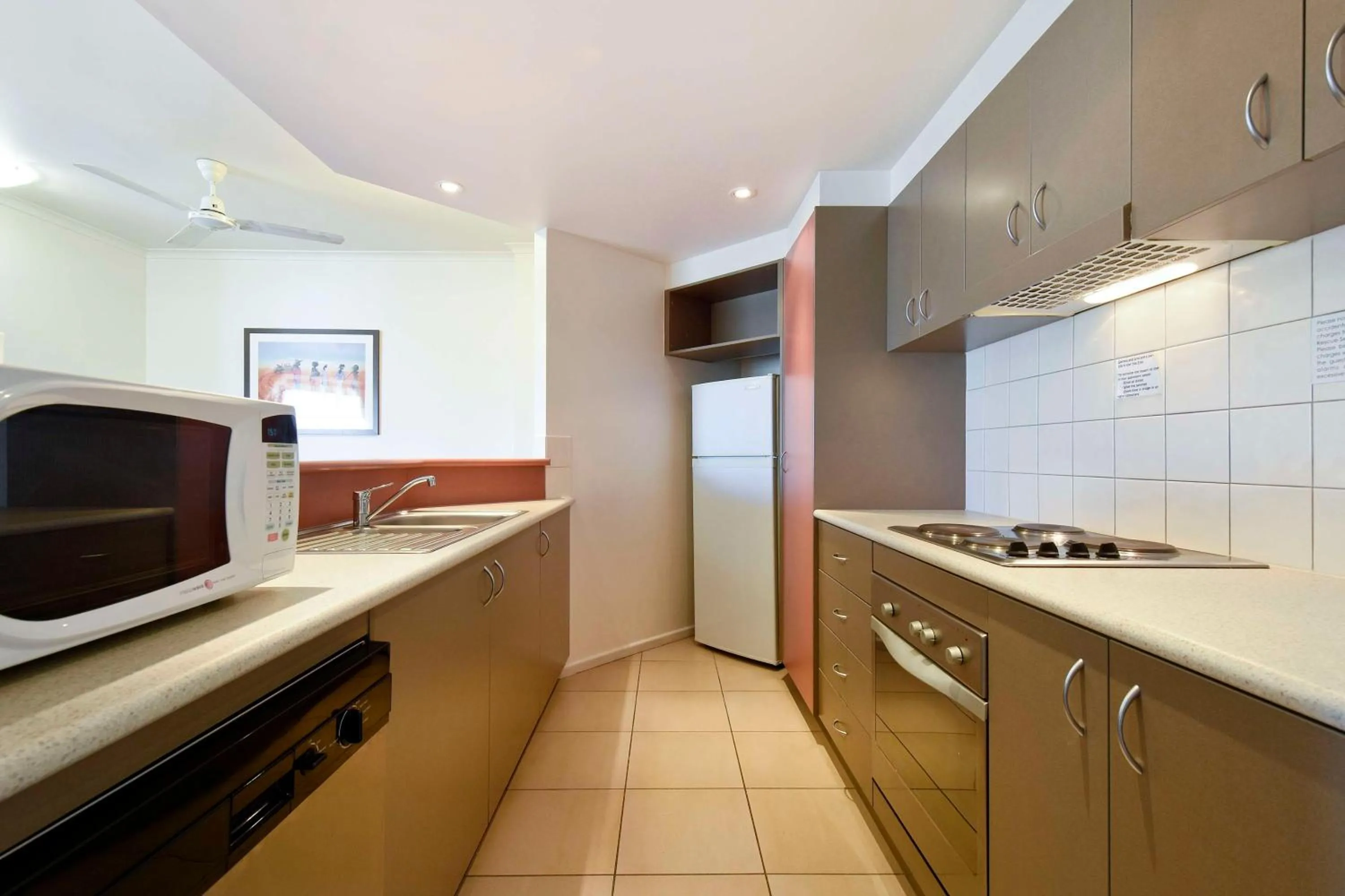 Kitchen or kitchenette in Metro Advance Apartments & Hotel