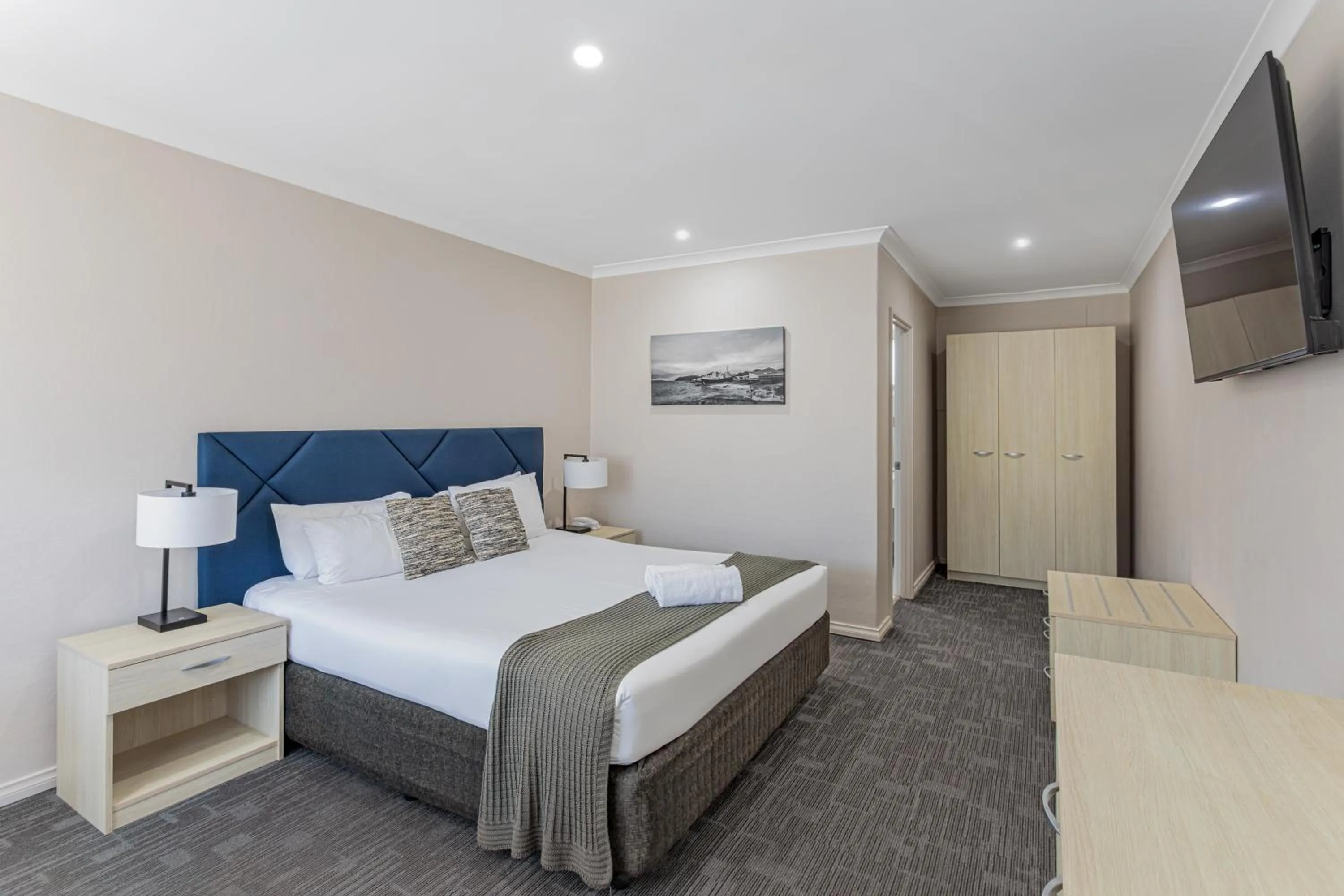 Toilet, Bed in Mandala Ace Albany Hotel