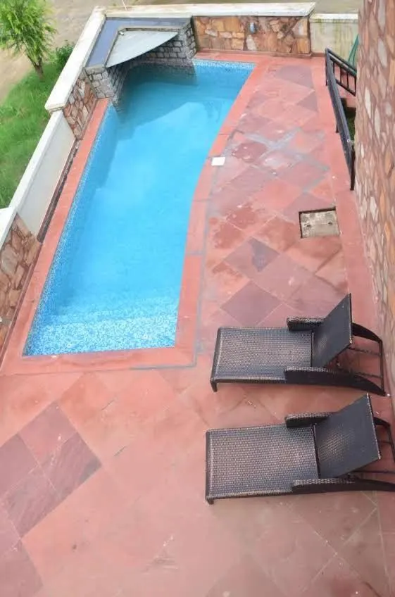 Pool view in Riverarch Greenfields Resort