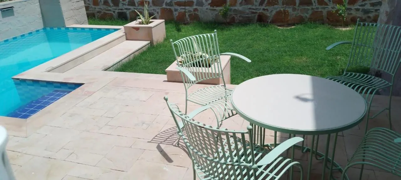 Pool view in Riverarch Greenfields Resort