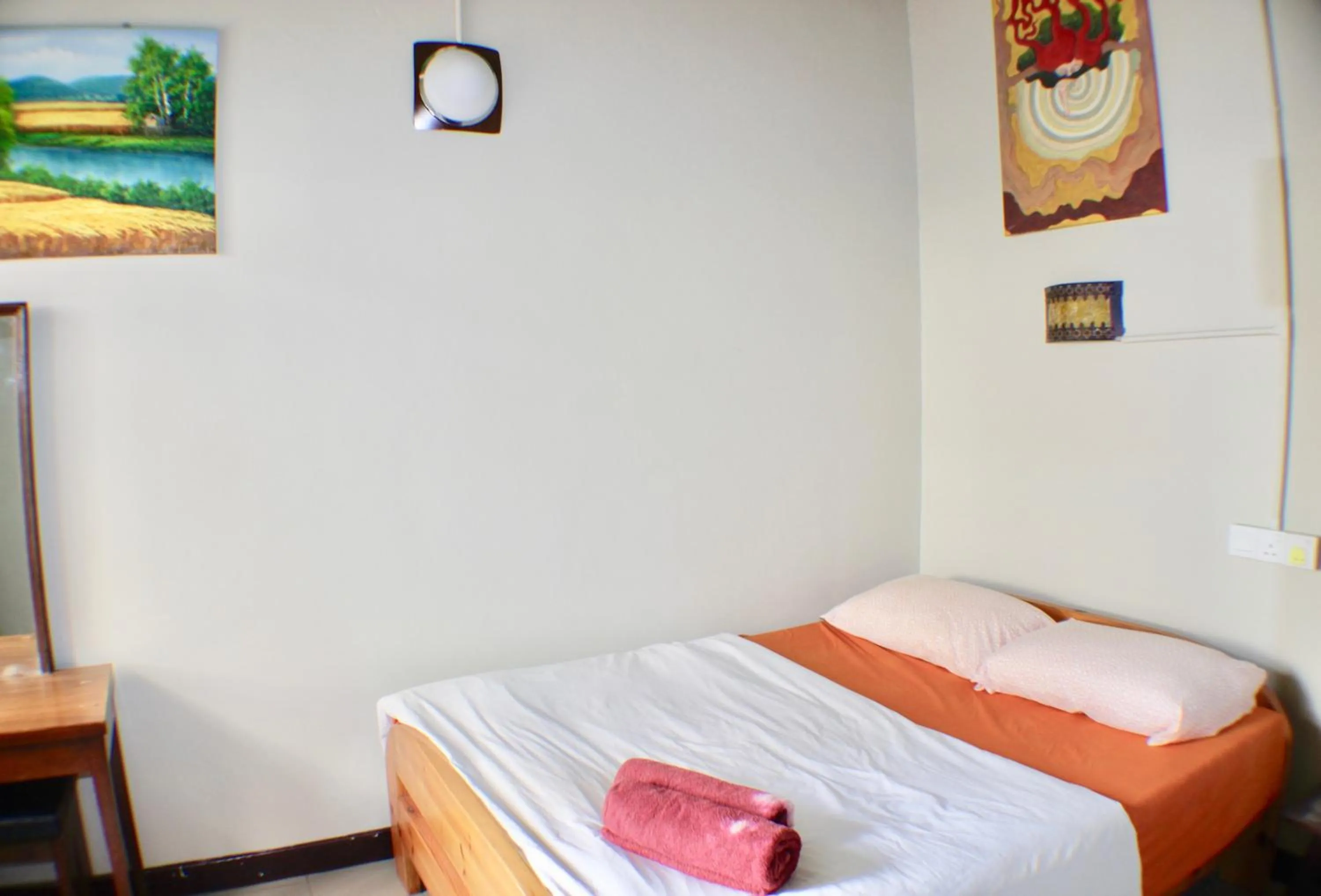 Bed in Birdnest Guesthouse, Gaia Rooftop Cafe