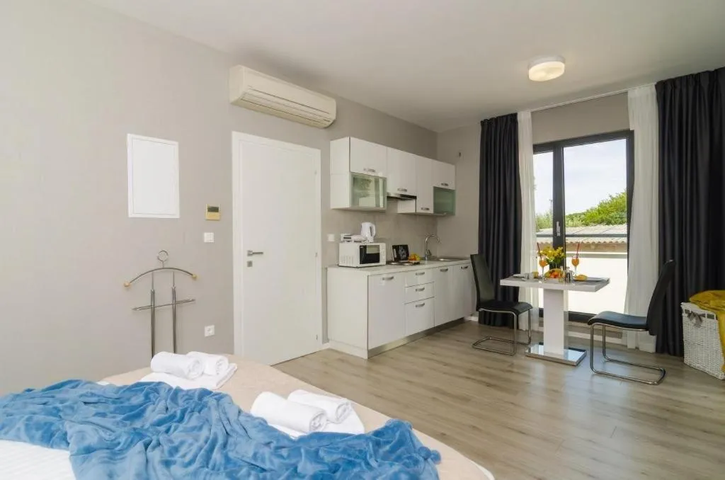 Kitchen or kitchenette, Bed in Apartments ZoomZoom