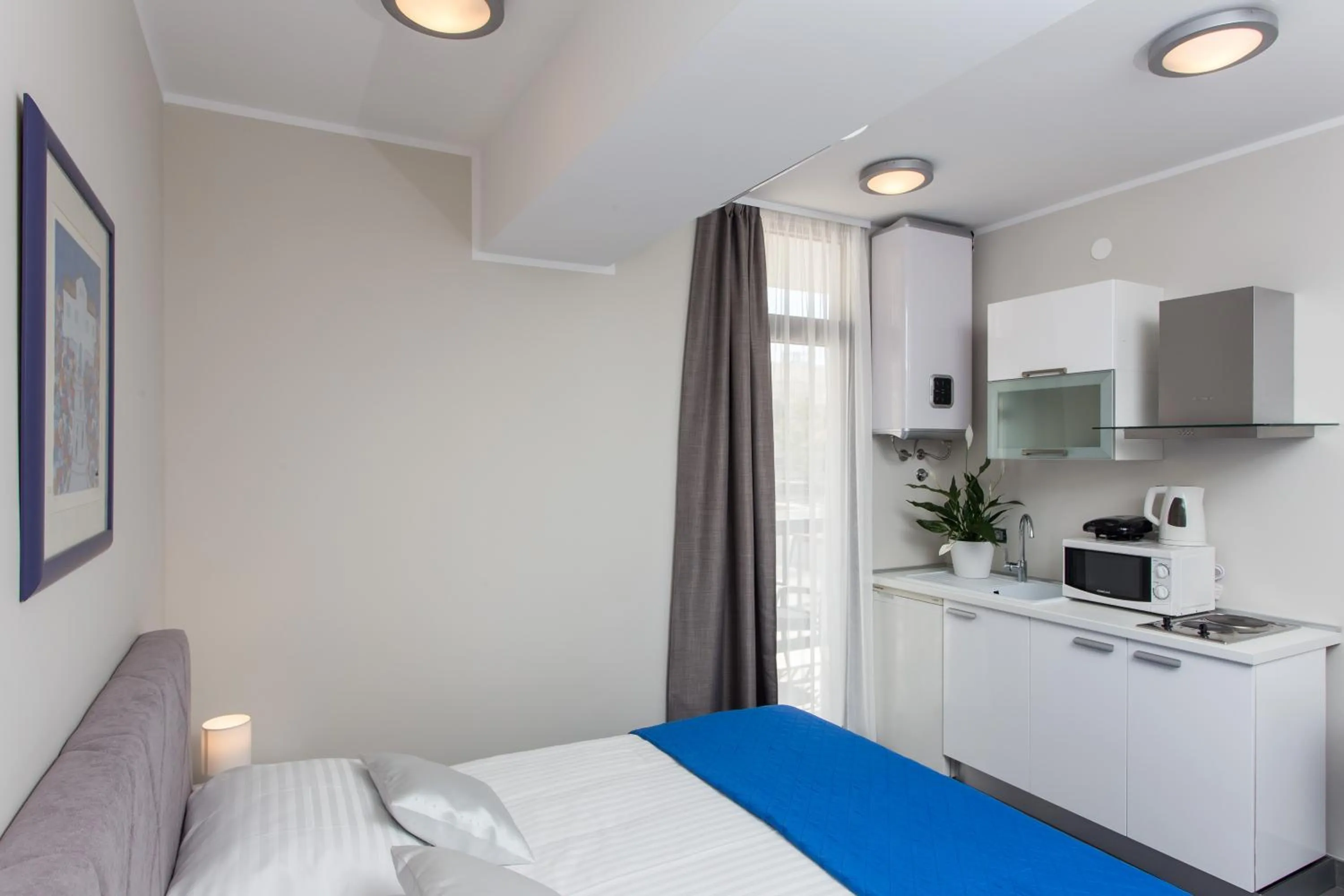 Kitchen or kitchenette, Bed in Apartments ZoomZoom