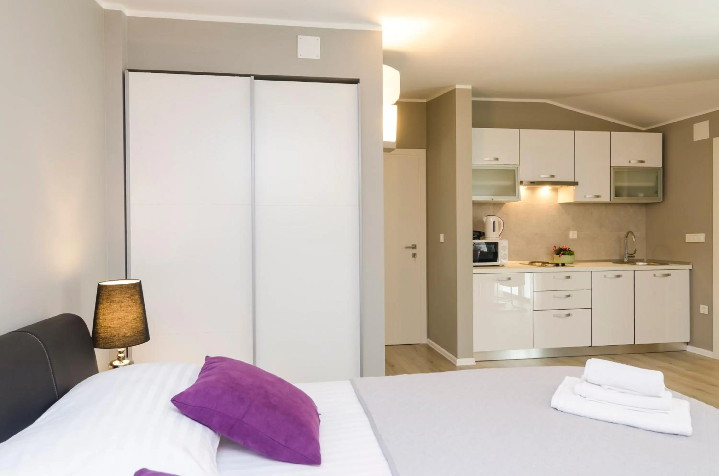 Kitchen or kitchenette, Bed in Apartments ZoomZoom