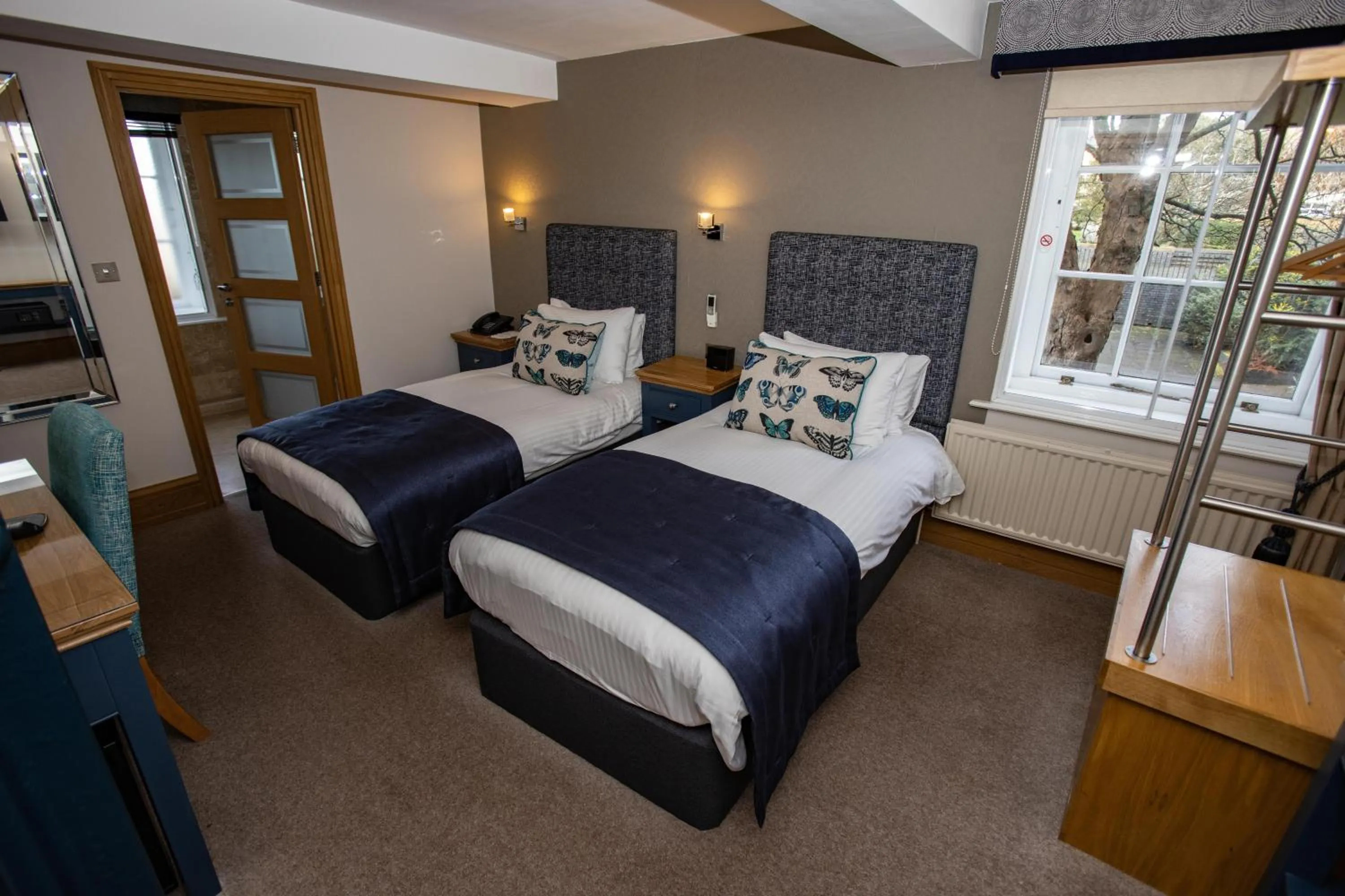 Bed in Ennios Boutique Hotel