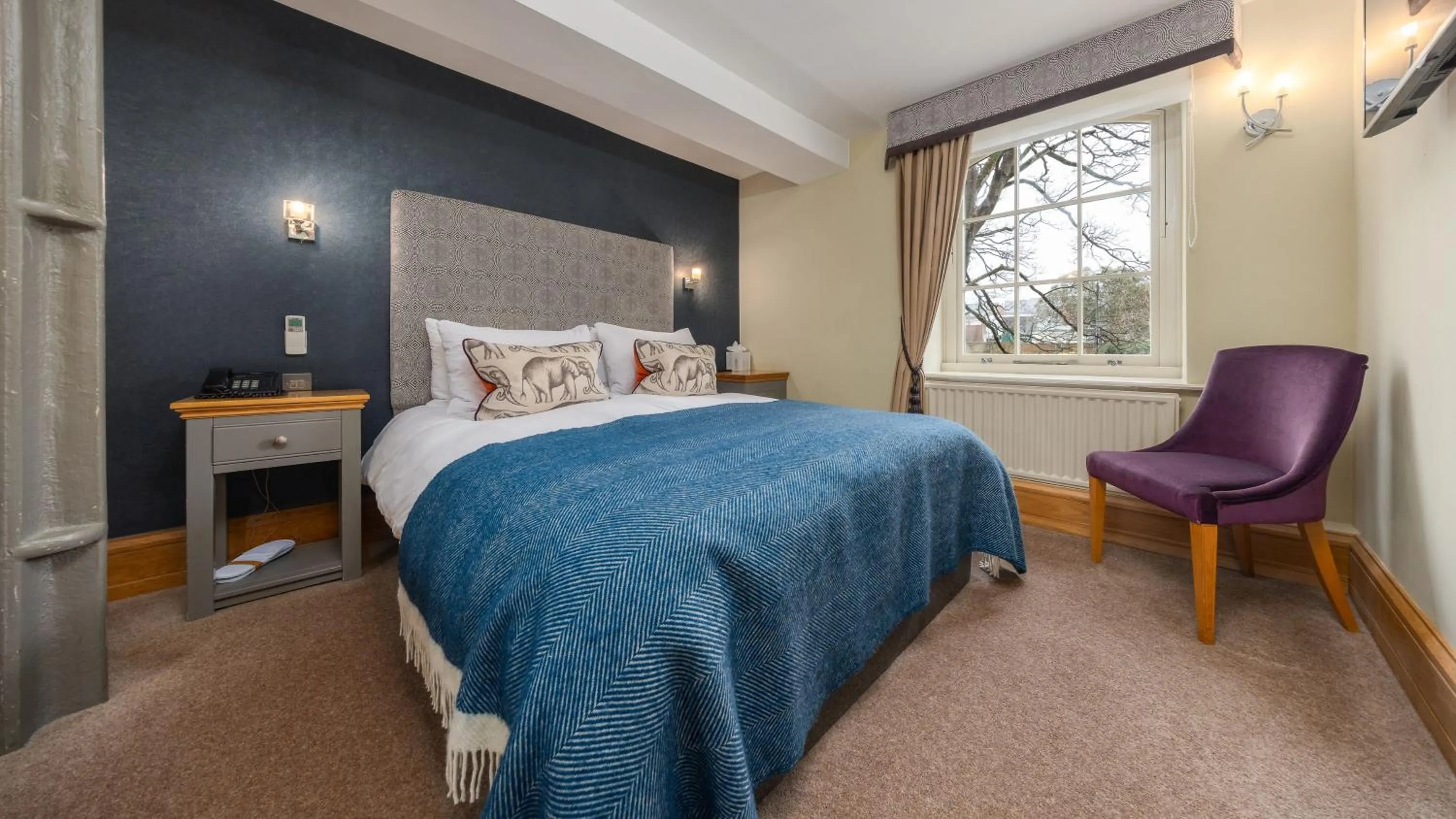 Bed in Ennios Boutique Hotel