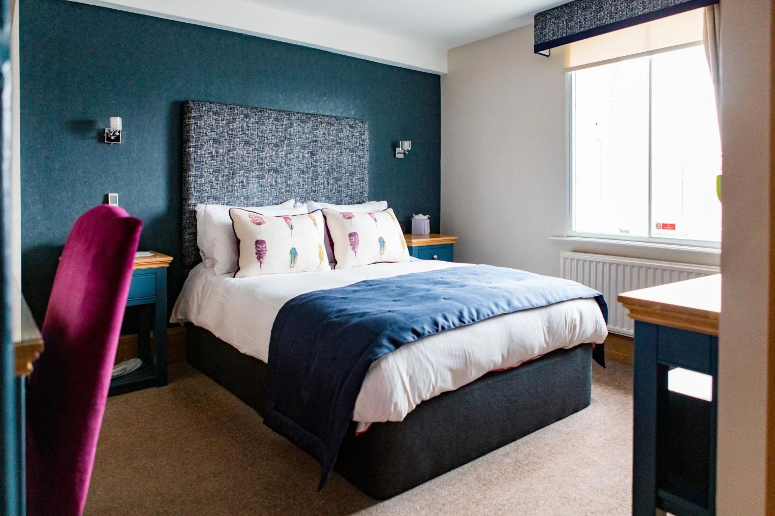 Bed in Ennios Boutique Hotel