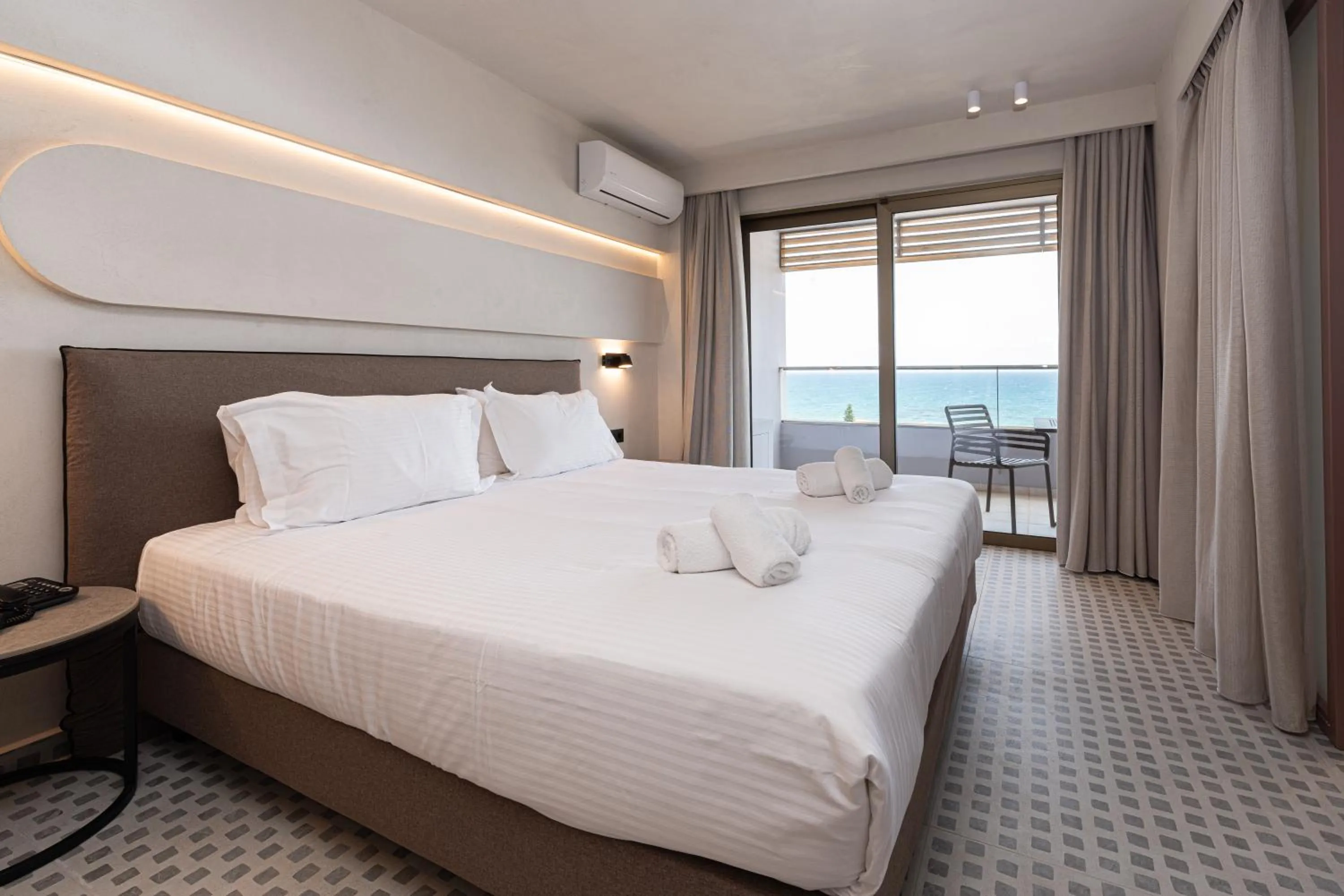 Bed in Iolida Beach by Smile Hotels