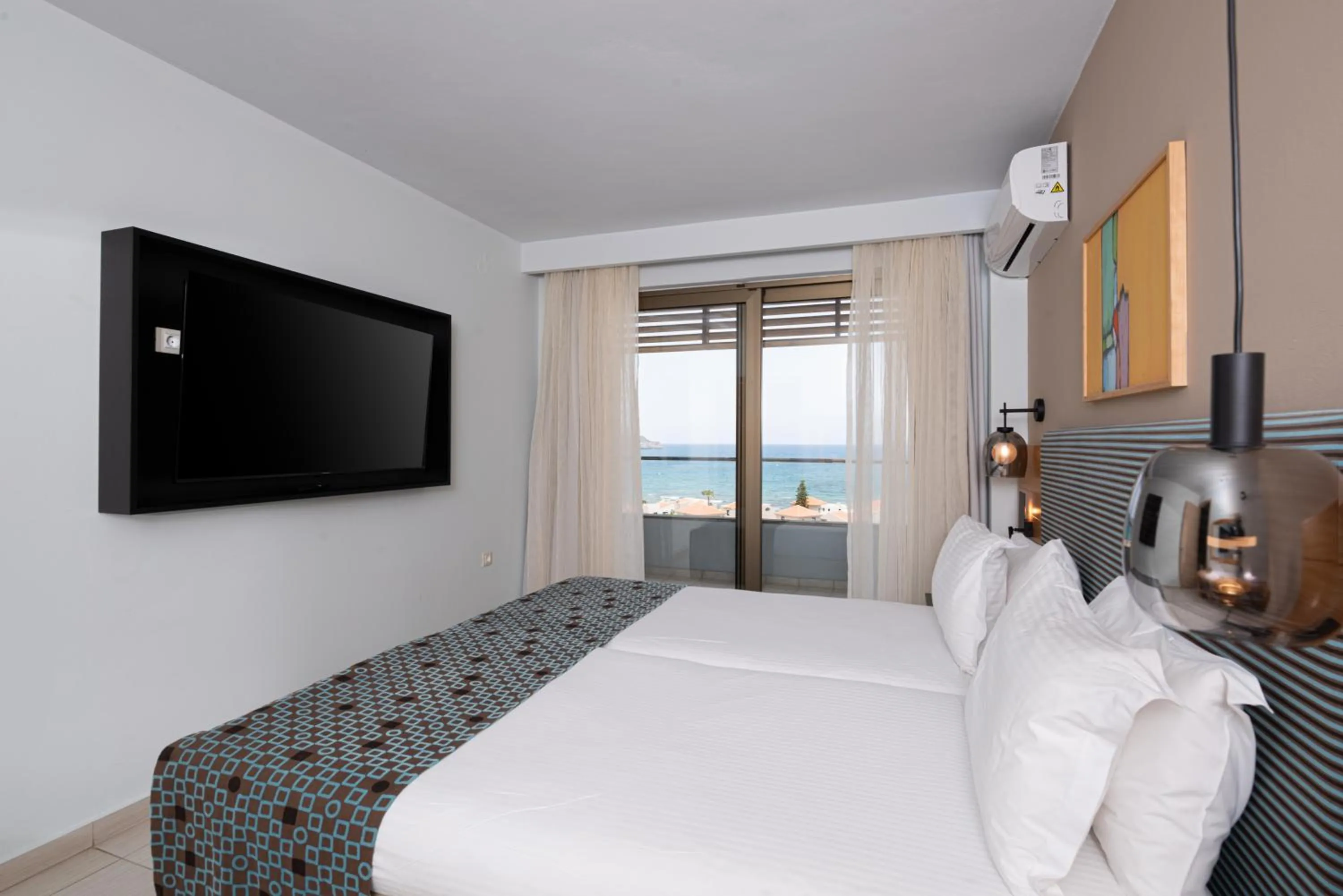 Bed in Iolida Beach by Smile Hotels