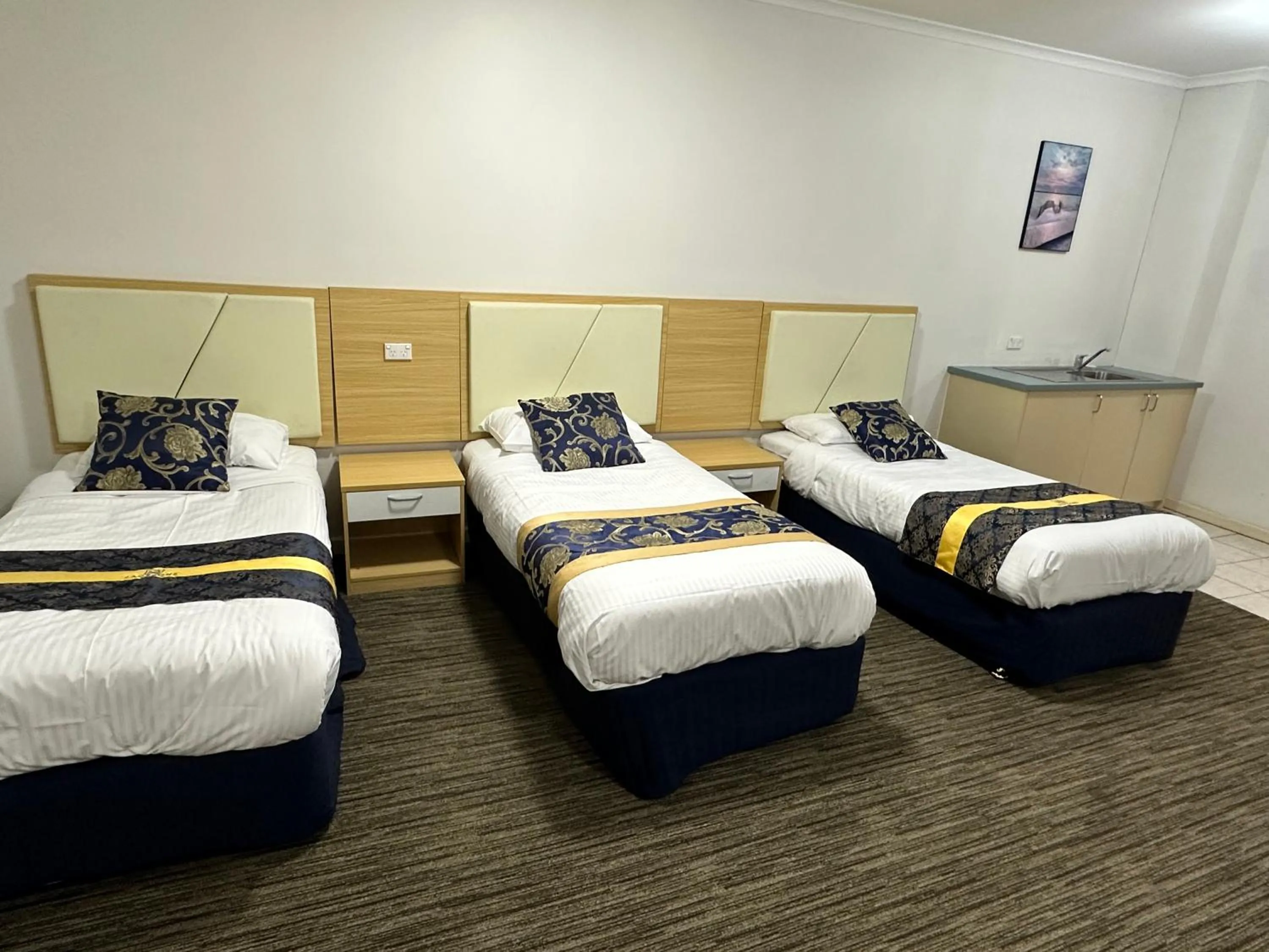 Bed in Jacksons Motor Inn